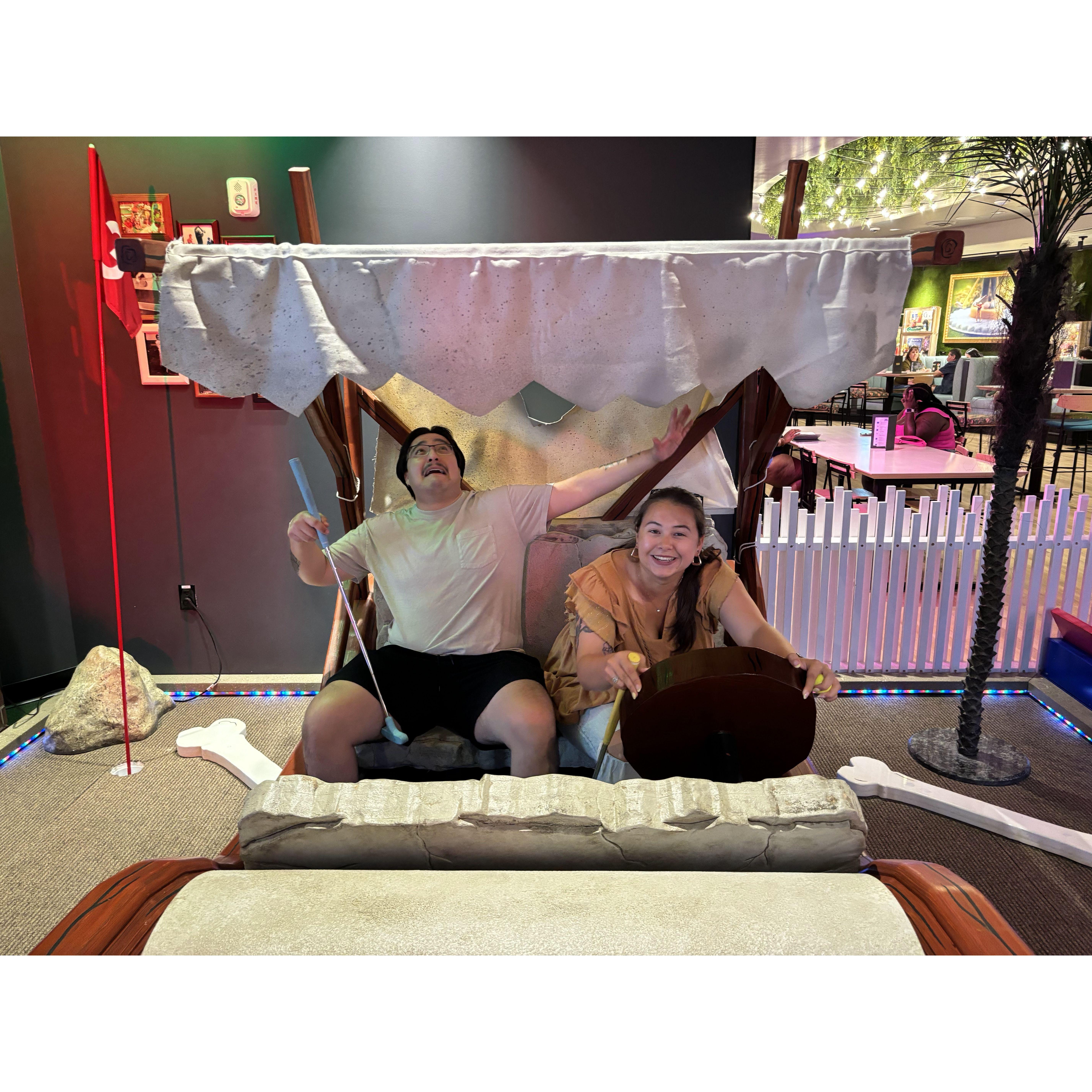 We went mini-golfing and Madison was having too much fun with all the small little props.