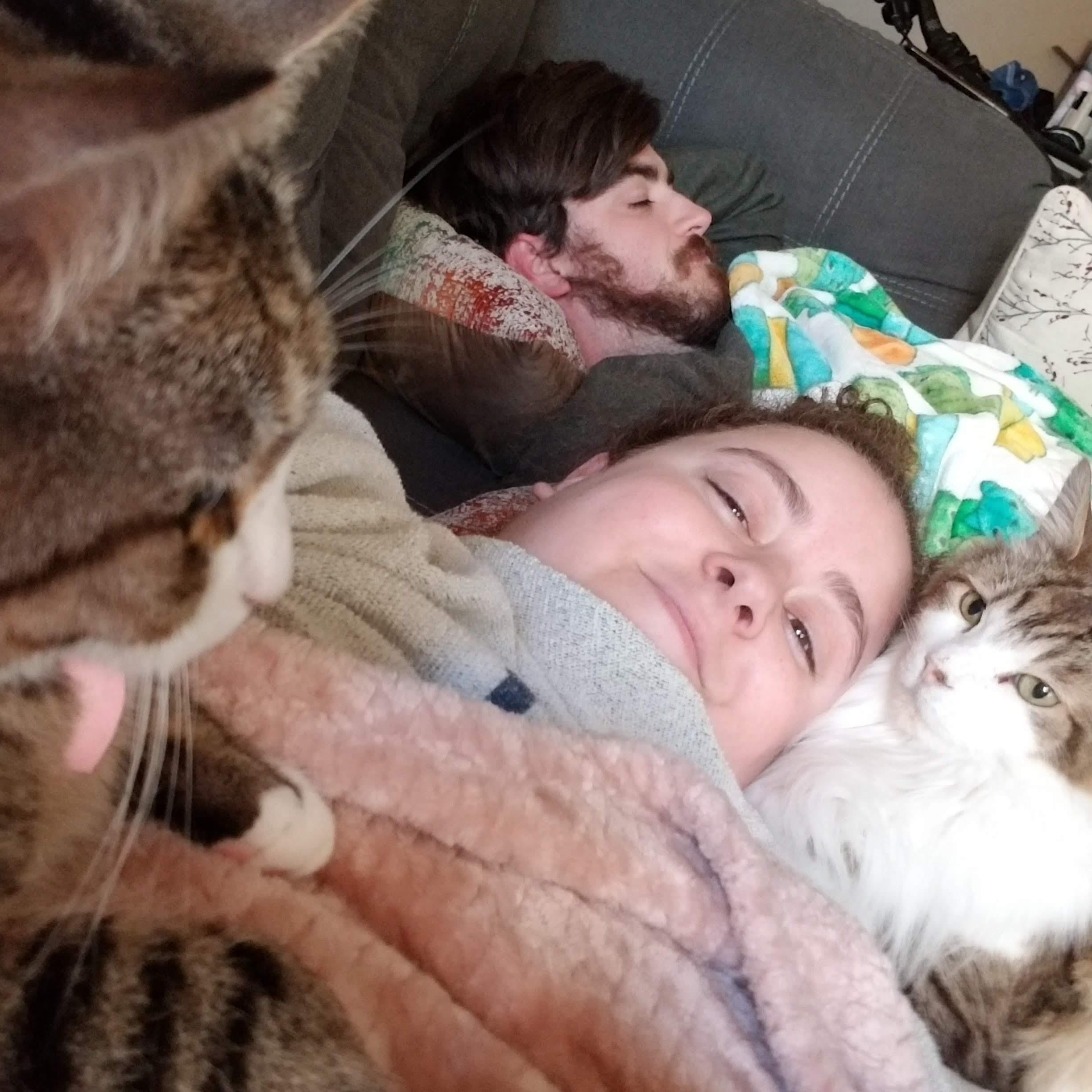 Couch naps with cats are a staple in our lives