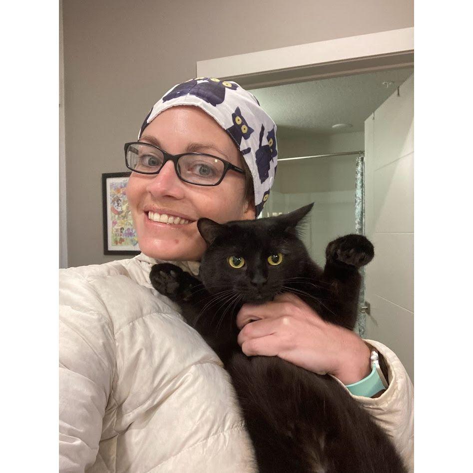 Olive Cat did not enjoy the scrub caps in her likeness that Doug got for Colleen. He's "not really a cat person...".