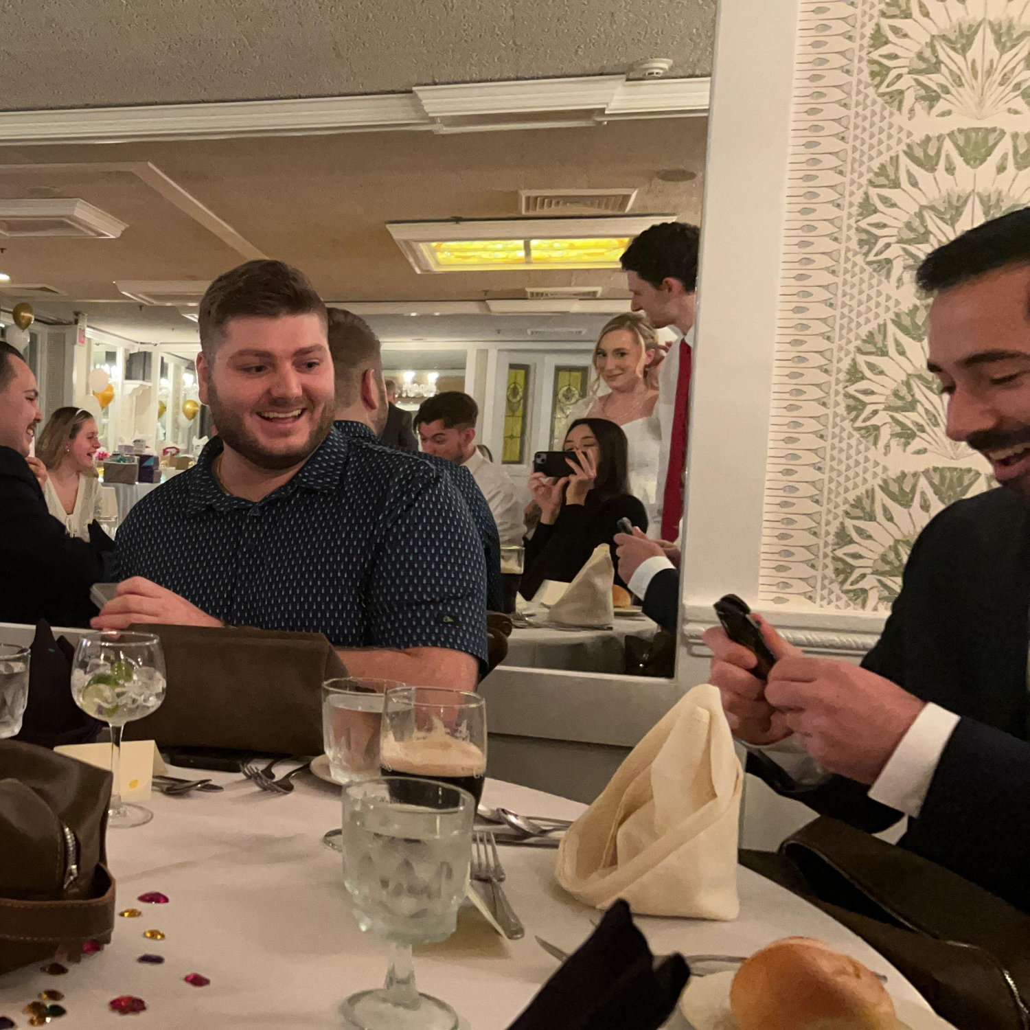 Groomsmen opening their Groomsmen gifts.