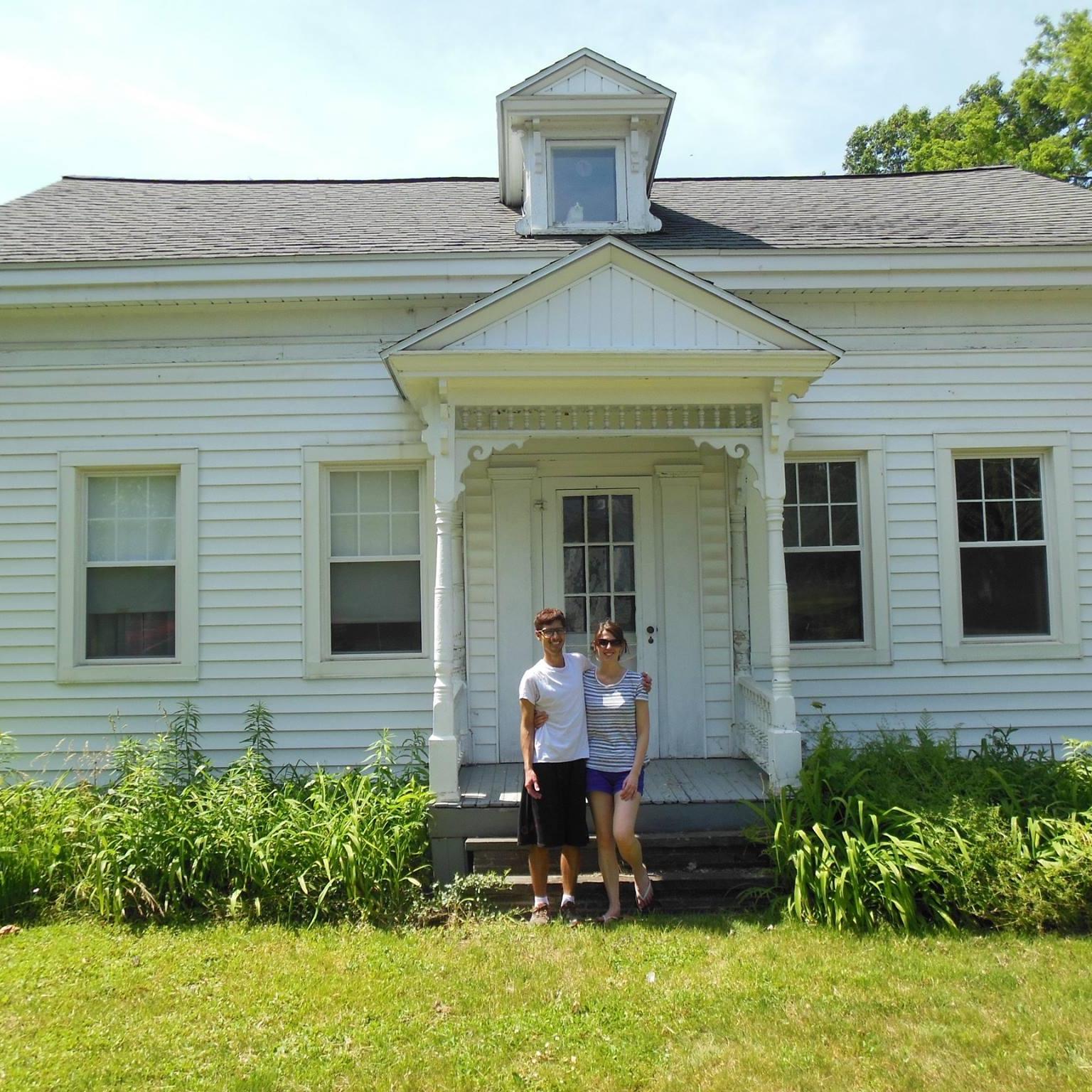 Us in front of the house we bought together
