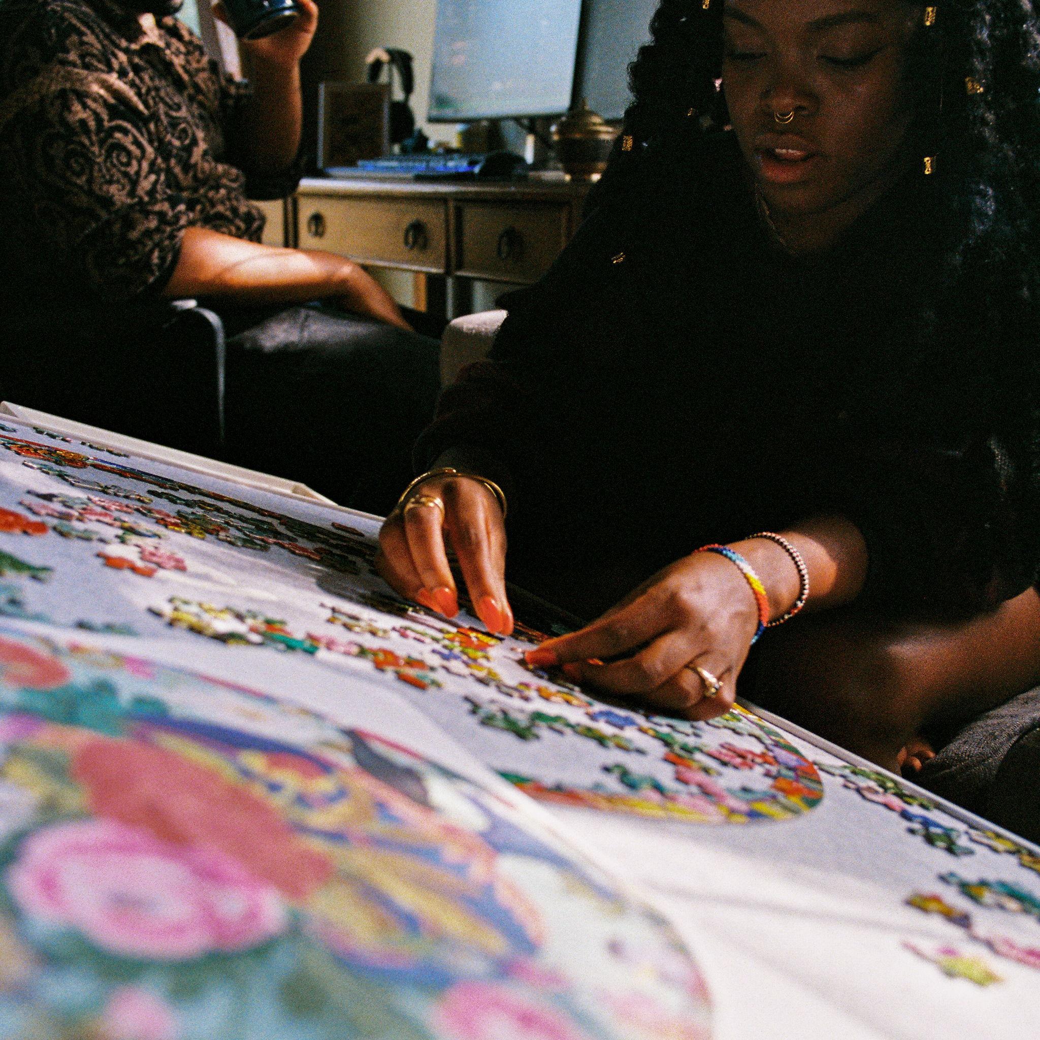 One of our favorite things to do is "parallel play"! Mwikali does puzzles and Eric plays video games, just two best friends hanging out.
