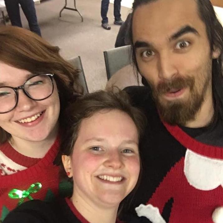 Our forever best friend, Sarah and us at a Christmas Party!