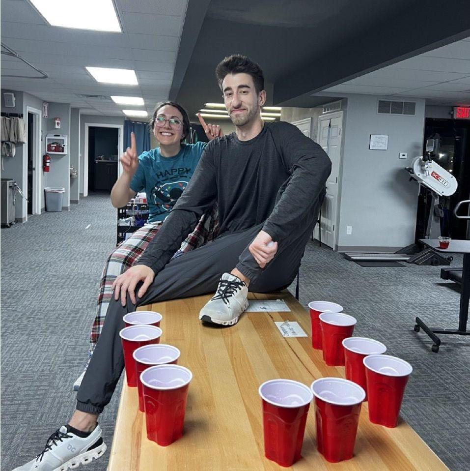 Before we started dating, we were partners at our work Christmas party beer pong tournament. And we won!