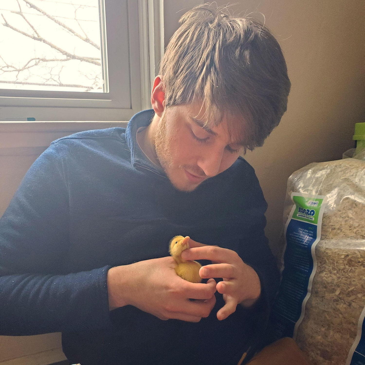A man and his duckling.