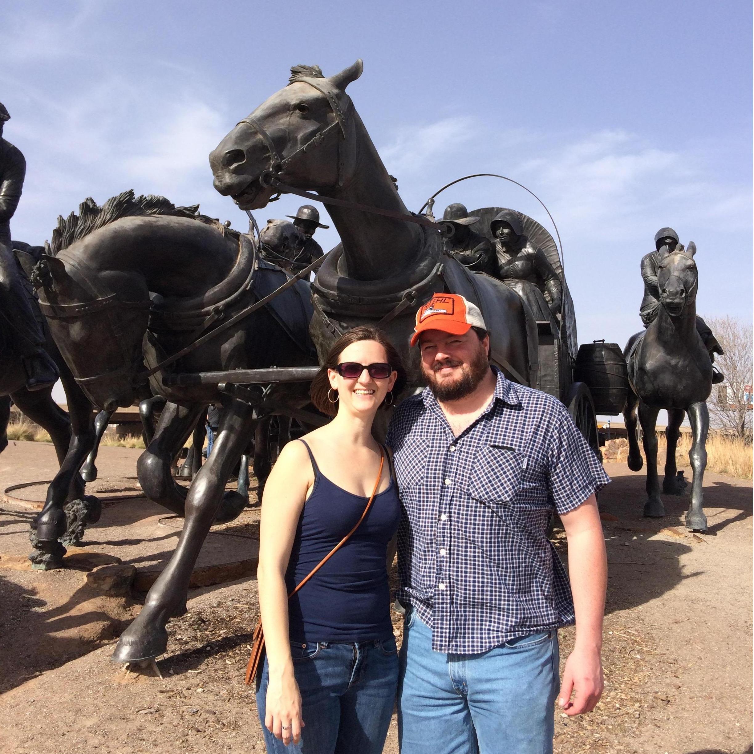 In front of the Land Rush monument in OKC