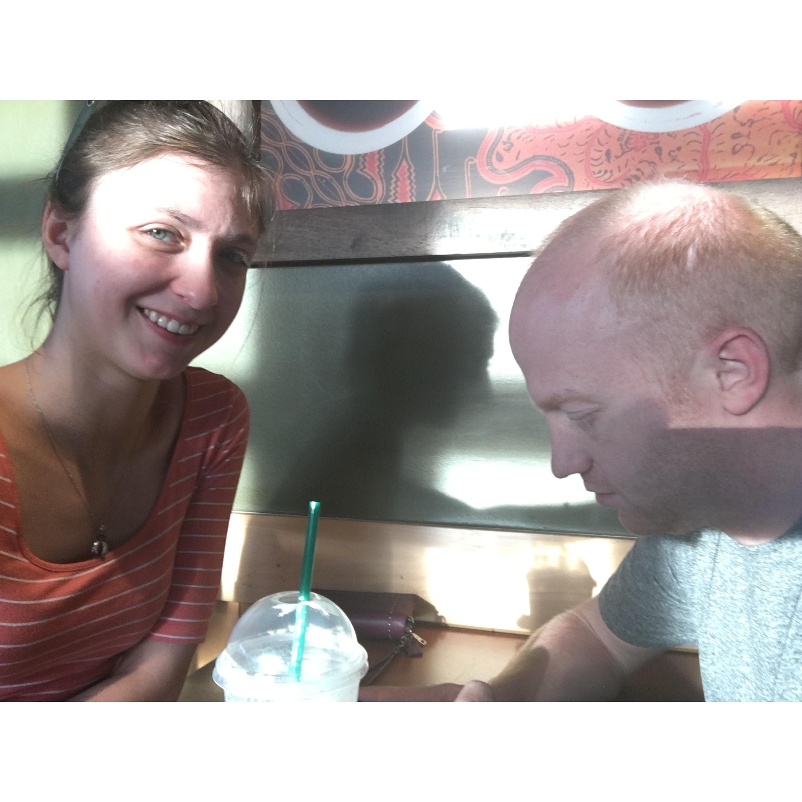 On the location of our first date!  Despite being almost July and at least 90 degrees outside, he still ordered hot coffee!