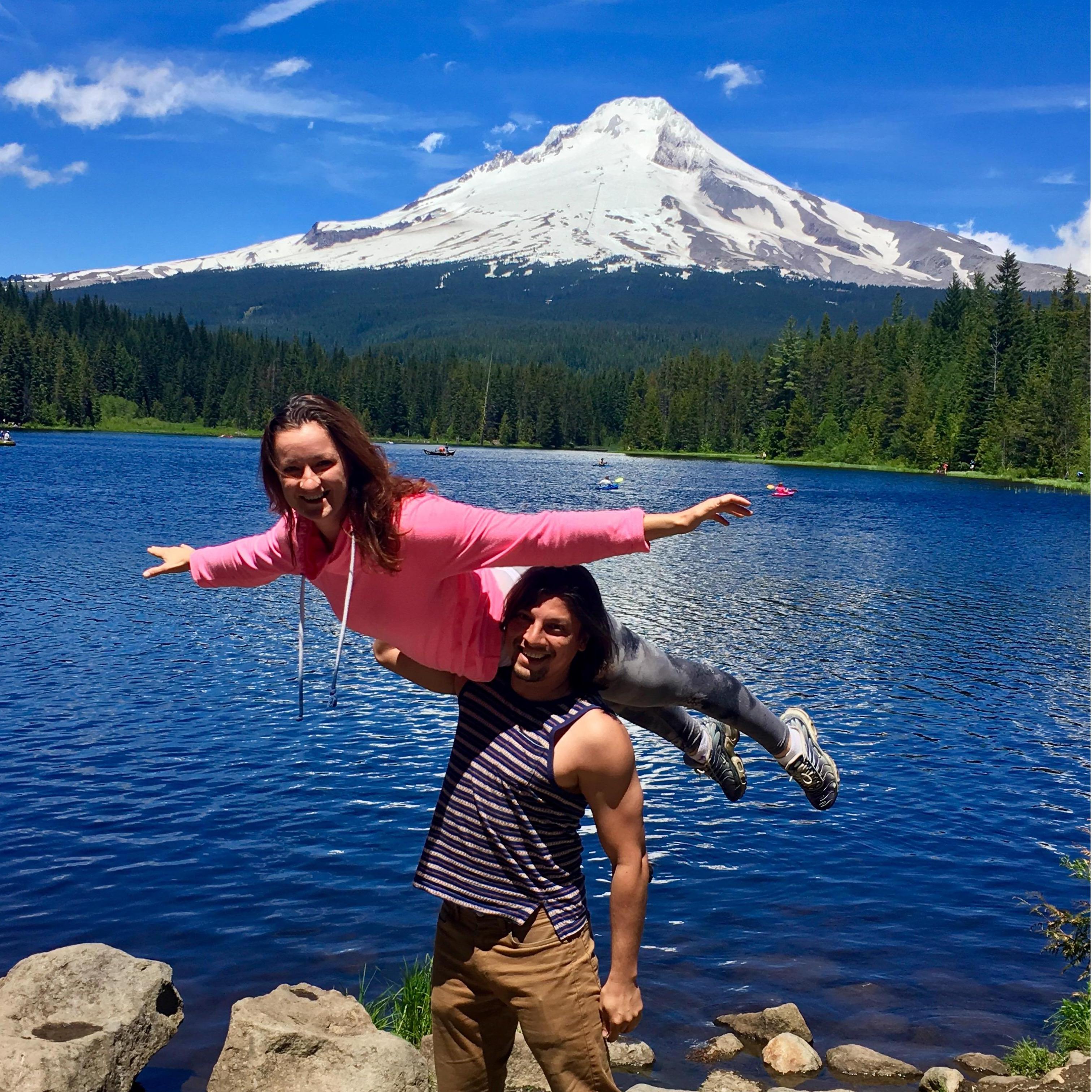 "Bird on Shoulder" acro pose by the Trilium Lake with a view of Mt. Hood.