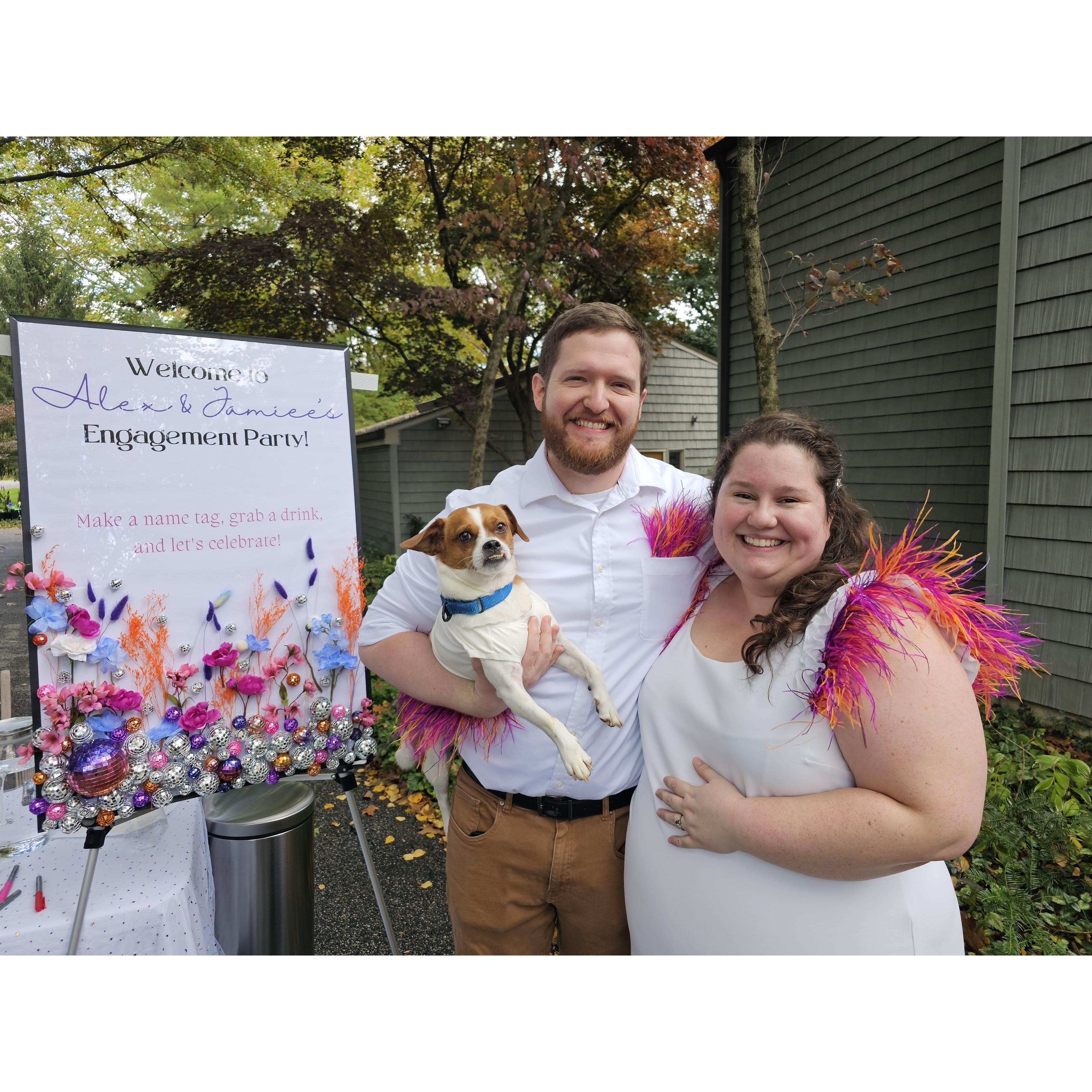 At our engagement party in 2023, with our dog Juice.
