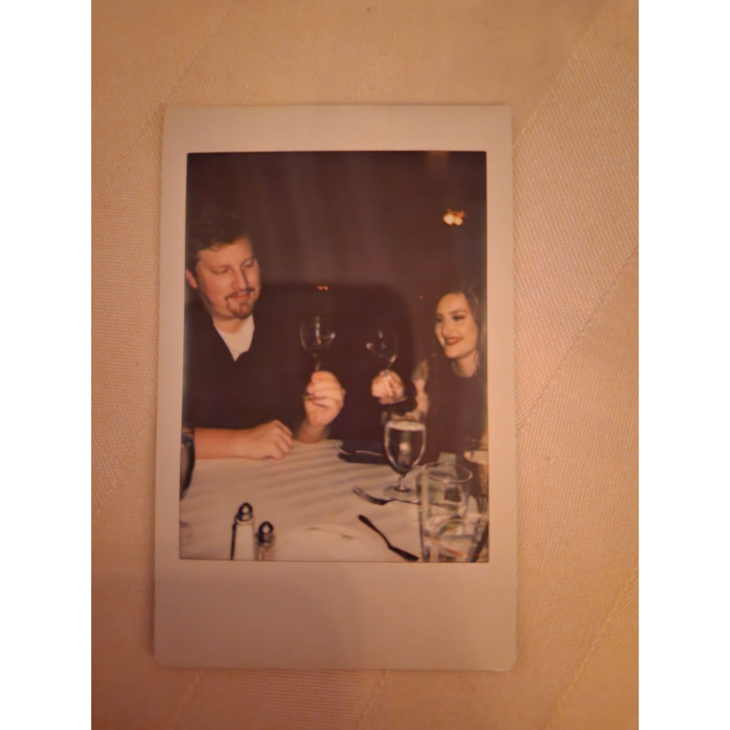 A polaroid from Megan's Wedding, with us swirling our wine glasses