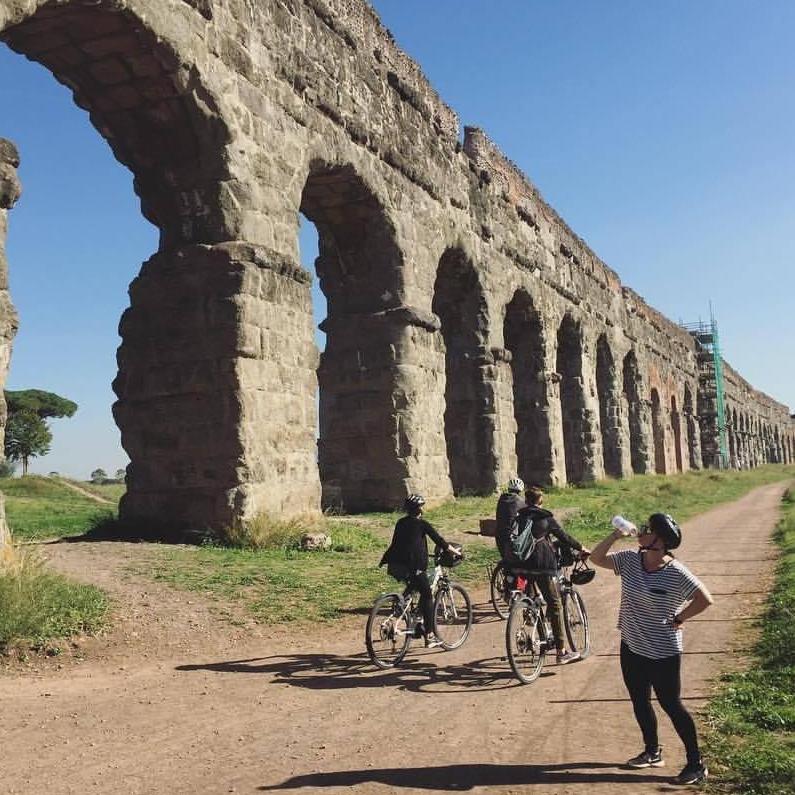 Bike riding through the aqueducts via the Appian Way outside of Rome.