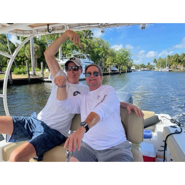 Rich and Captain Scottie, cruising Ft. Laud canals