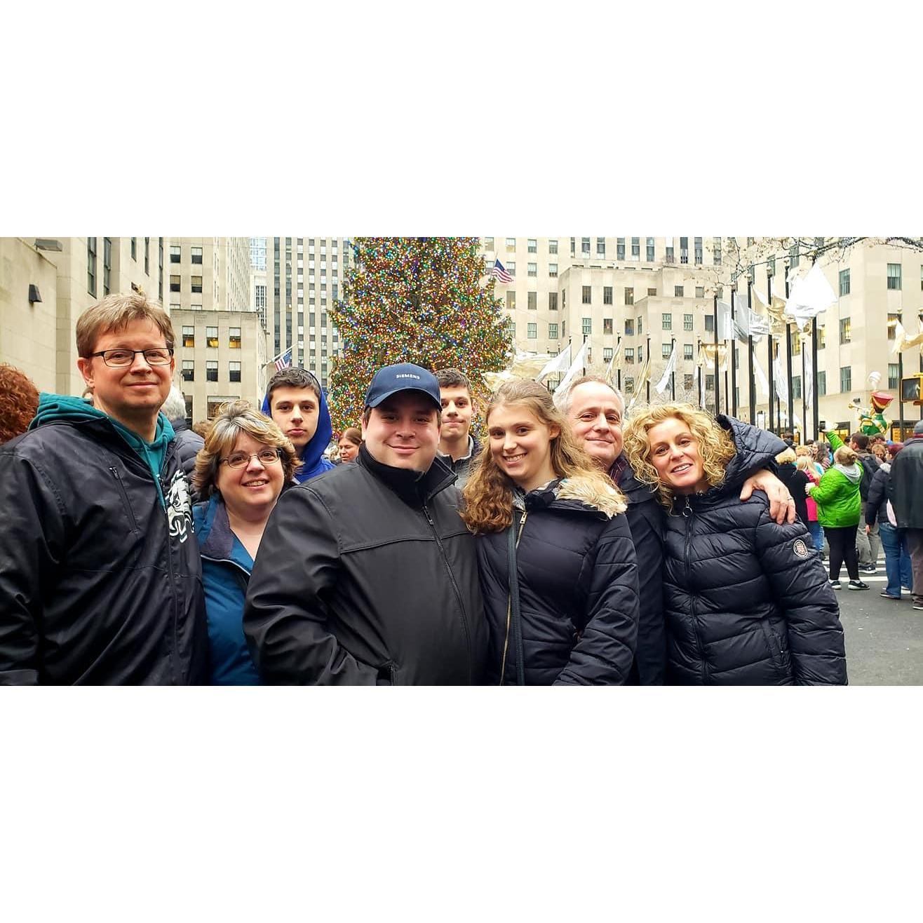Jenny, Dan, and their families in front of the Rockefeller Christmas tree in NYC.