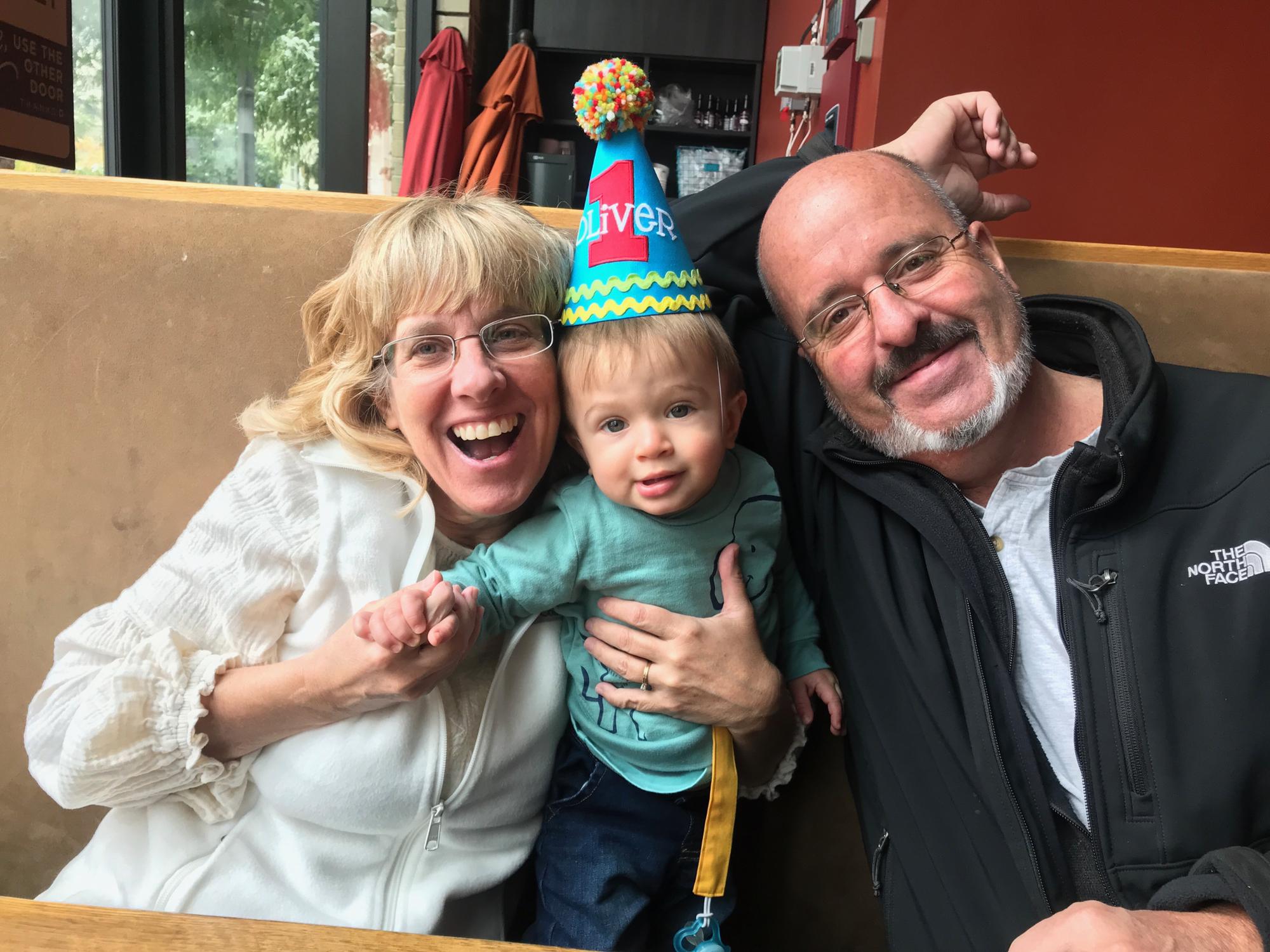 Grandma & Grandpa with Oliver on his 1st bday!