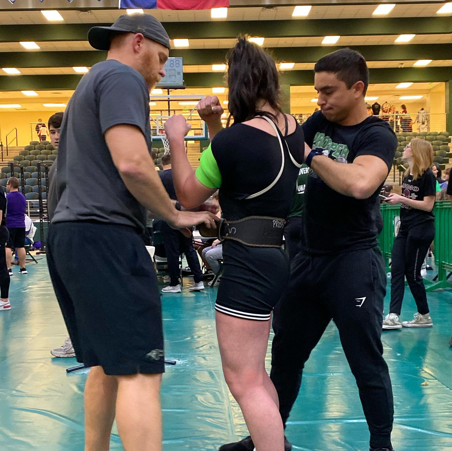 Marco helping Amandalynn at a powerlifting meet (where we technically met)