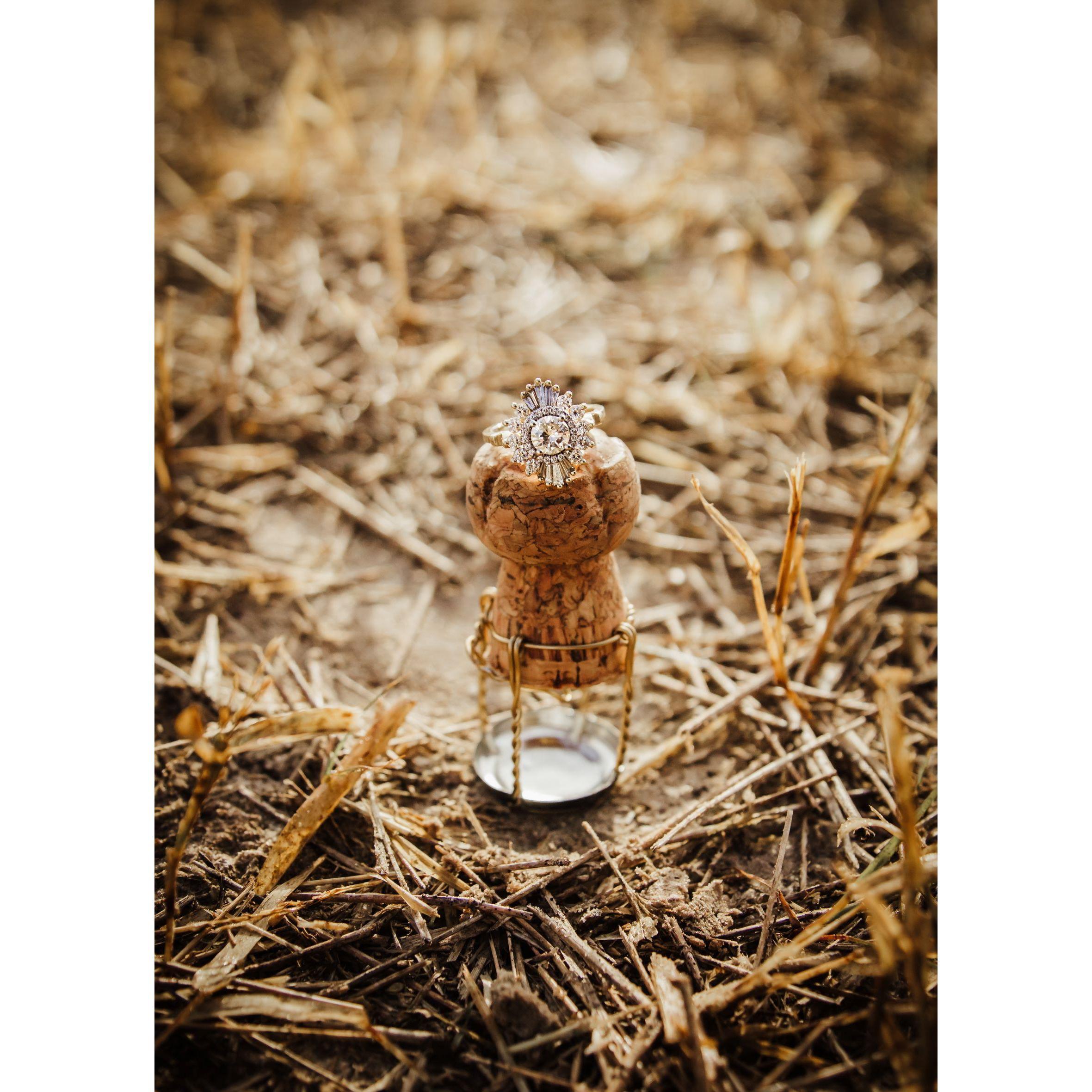 Christie's art deco custom engagement ring atop the couples "hot air balloon" from the celebratory champagne toast after landing safely back to ground.
