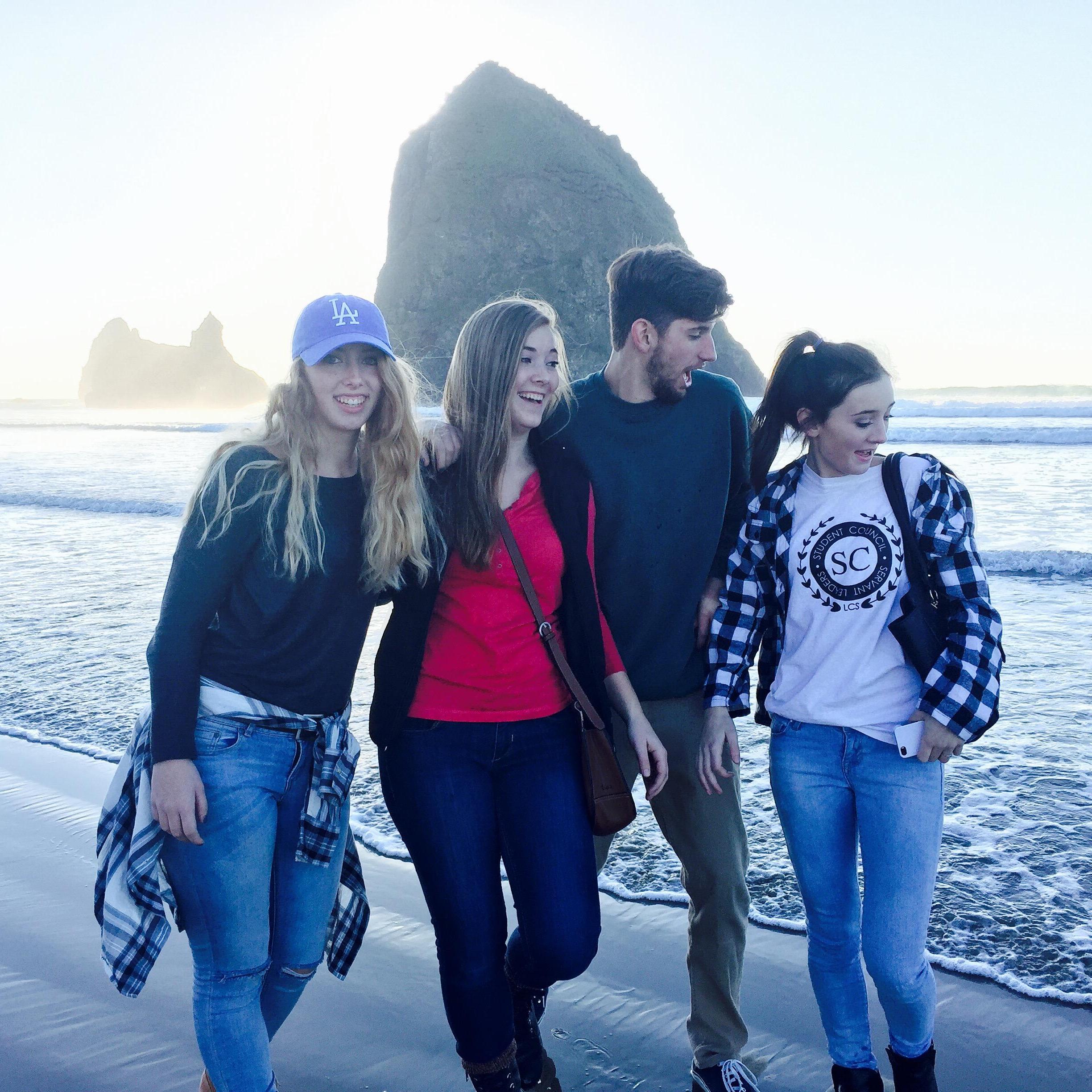 getting out of the way of the waves in 2015 with Tara's family at the Oregon coast!