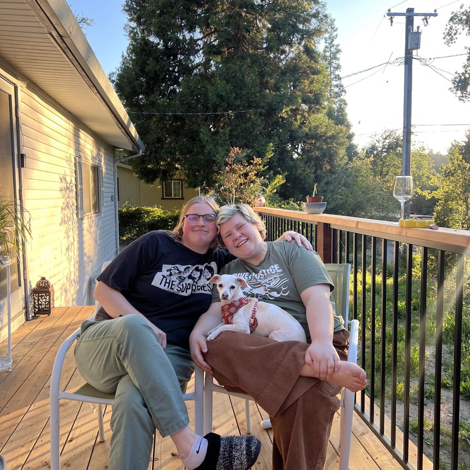 The couple sharing dinner on their new porch with their new dog, Pancake.