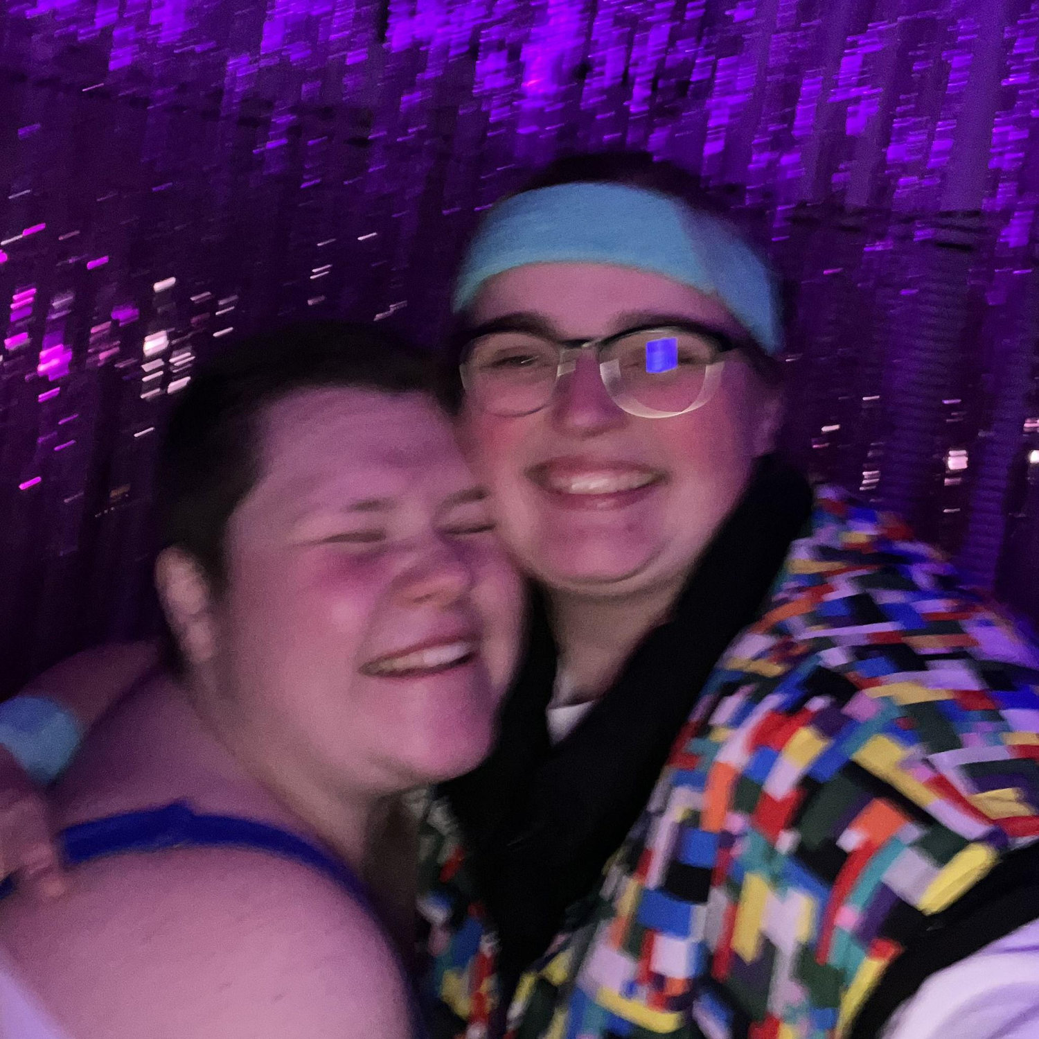 The couple dancing at Hannah’s 30th birthday party. The theme was “Decades,” and while both brides are 90s babies, they chose to dress in the bright colors of the 80s!