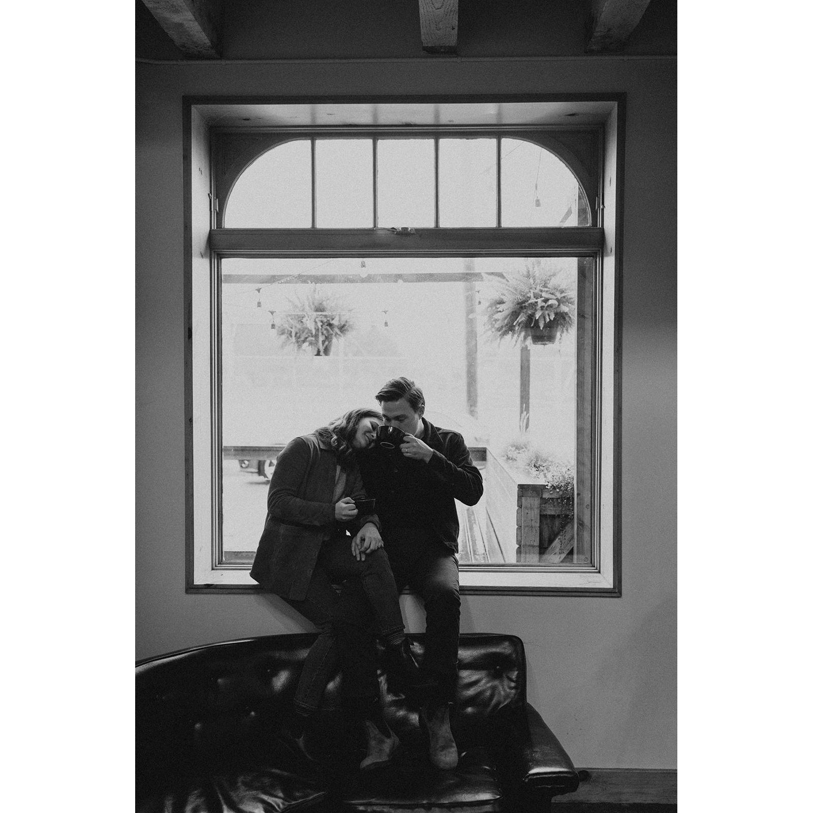 Engagement photos by In the Alpenglow at Bluebeard Coffee Roasters on a rainy day in Tacoma, Wahington in the fall of 2023.