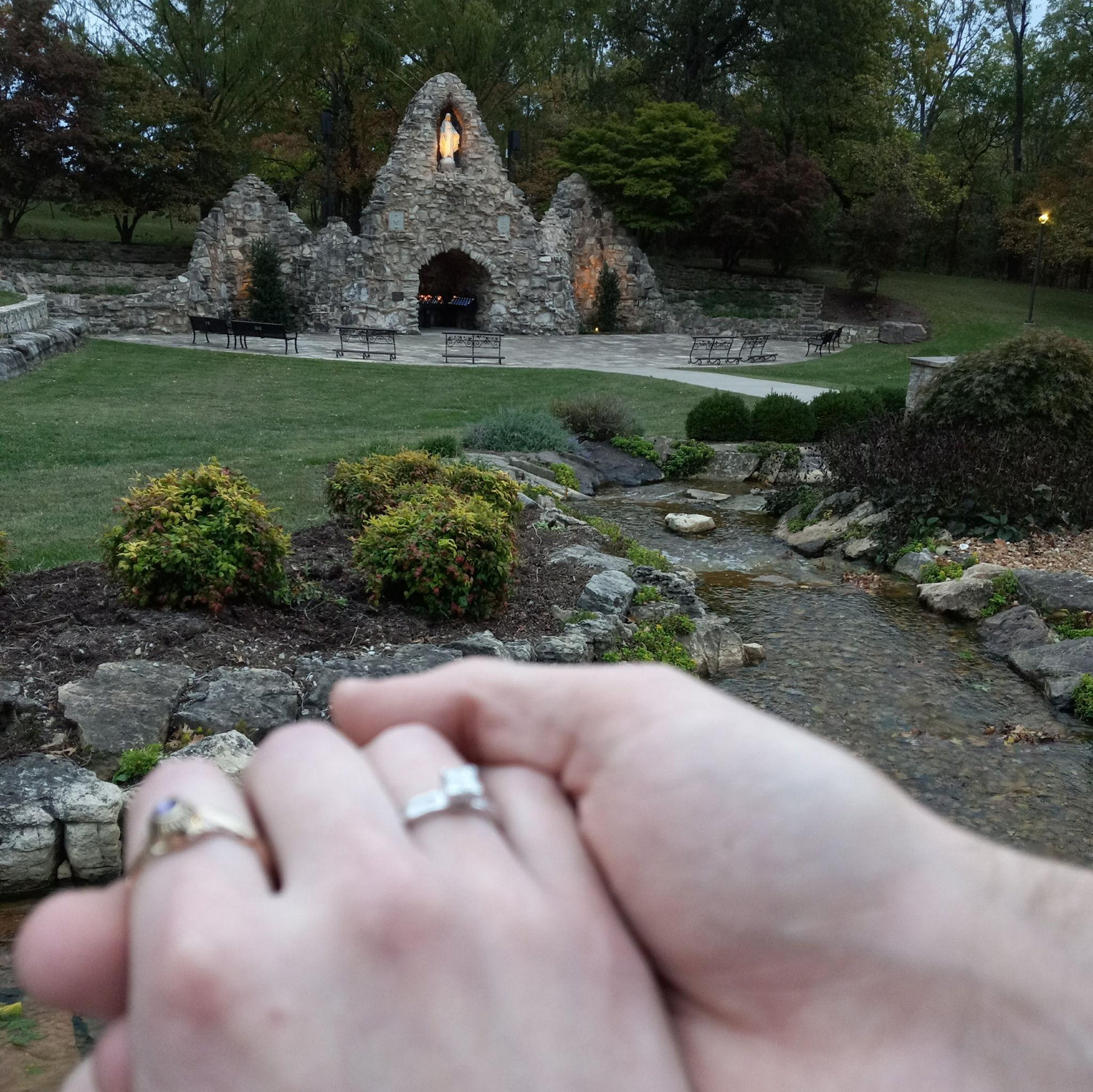 Odie popped the question in the grotto courtyard, under the view of Our Mother Mary!