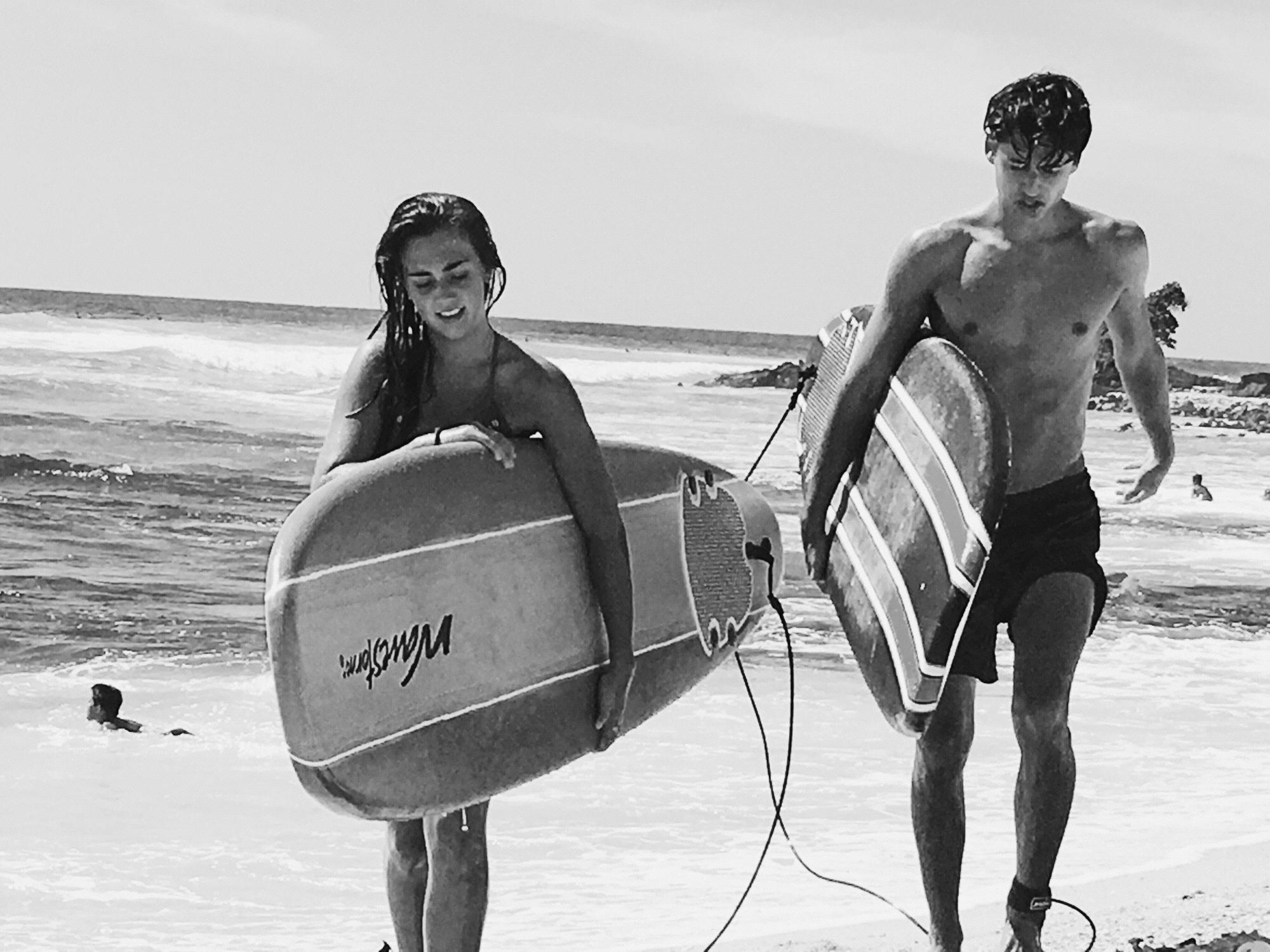 Micah teaching Rach to surf at his favorite childhood beach in Kona Hawaii before Rachel's DTS