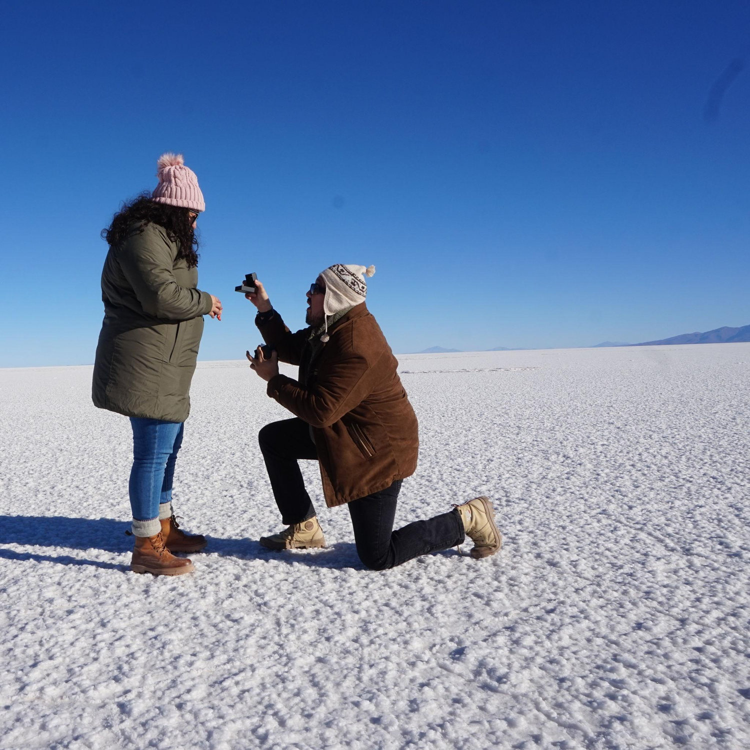 The moment Oscar proposed to Melissa in El Salar de Uyuni.