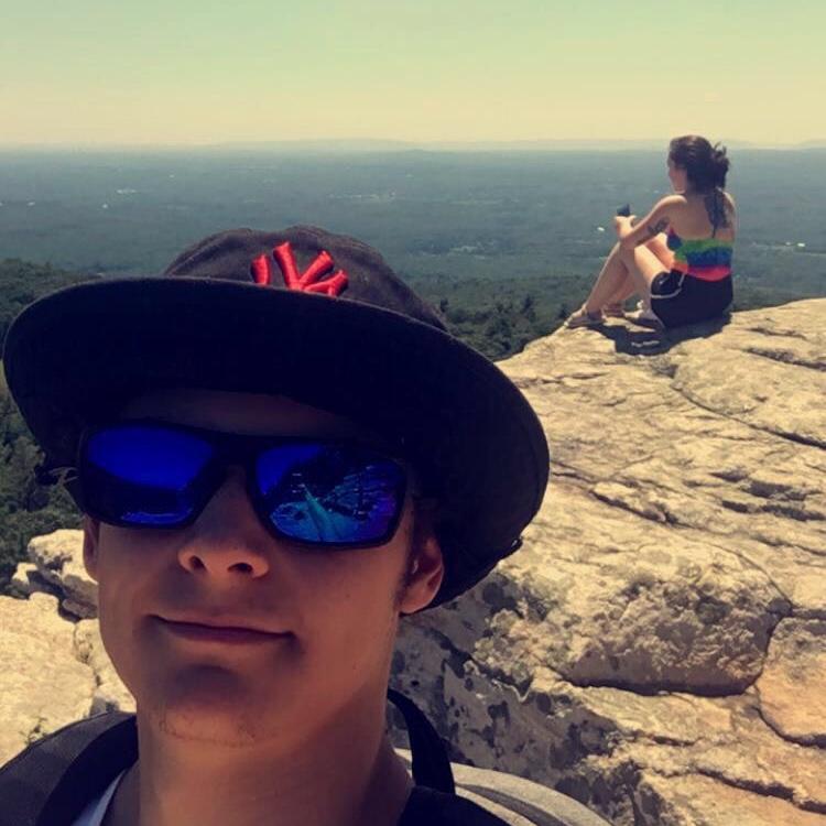 This was at the end of a 7-mile hike near New Paltz, New York. We squeezed our way through the lemon squeezer on the Labyrinth Trailhead.