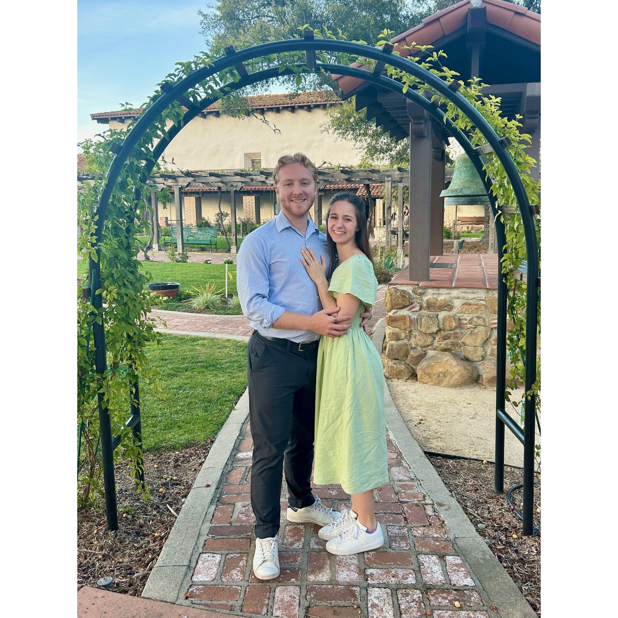 Aidan proposes at Mission Santa Barbara!