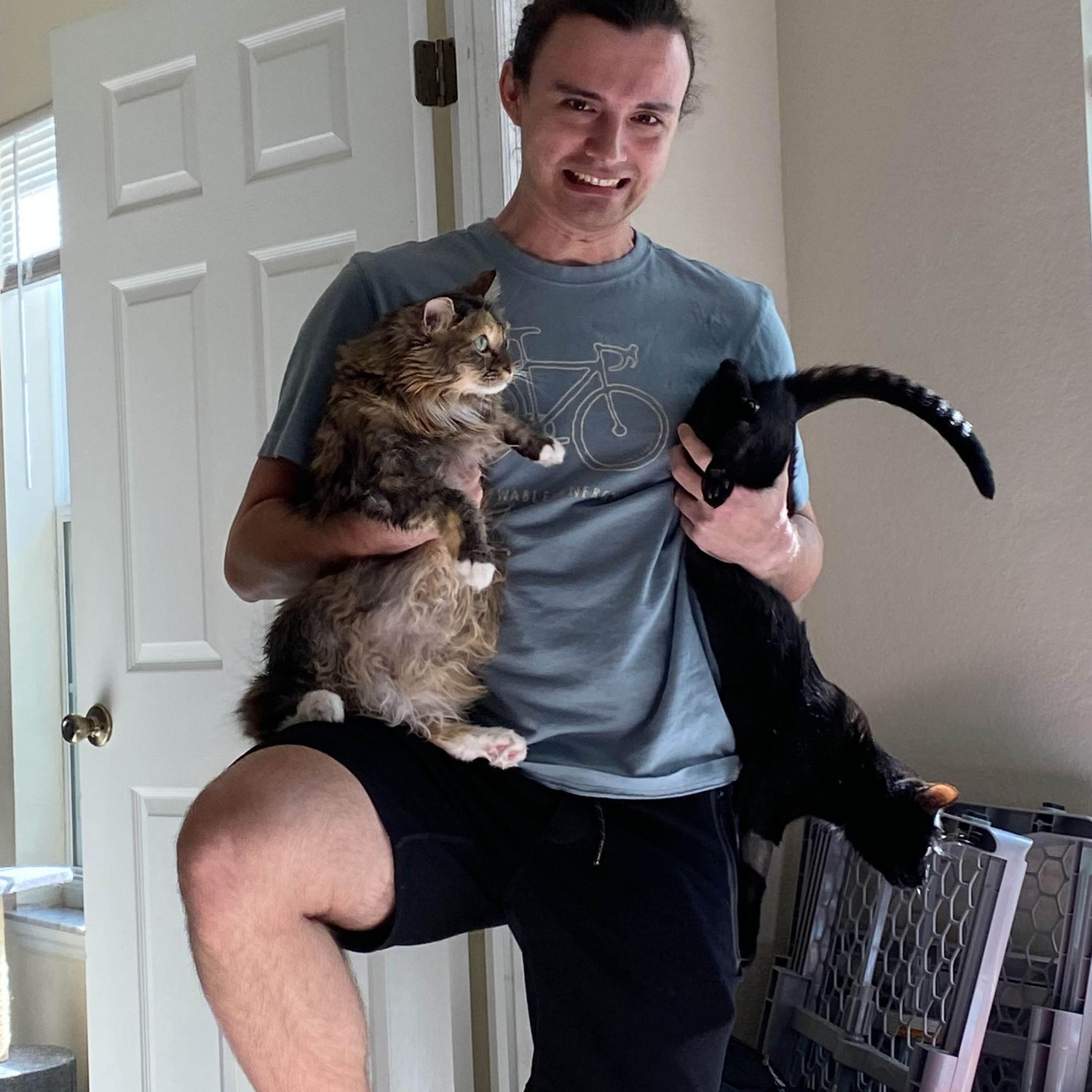 Joshua wanted a picture of him holding both cats