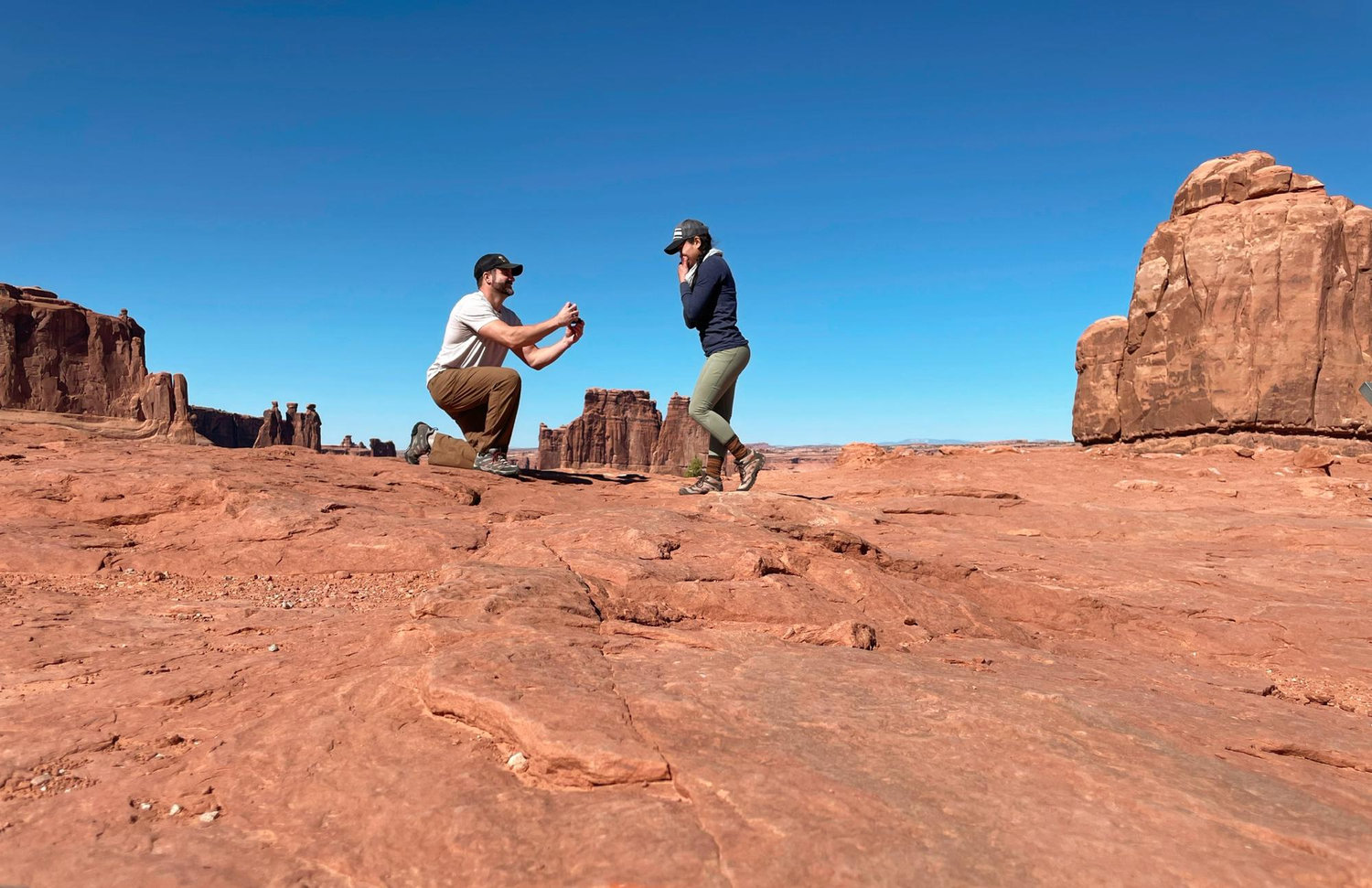 Re-enactment of Tim's actual proposal. 

Arches National Park, Moab, UT