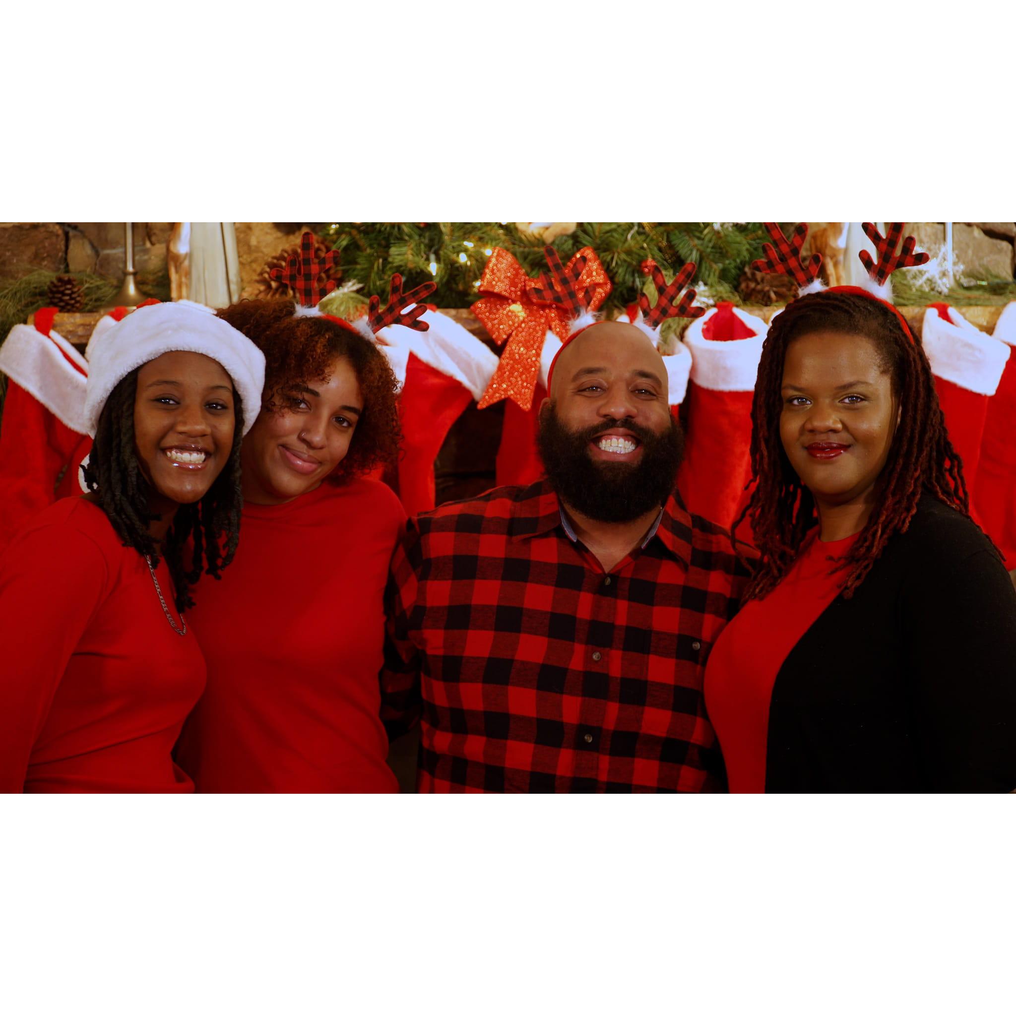 Us and the girls. We retook the pic because he wasnt smiling, then this the smile her gave us. Lol
