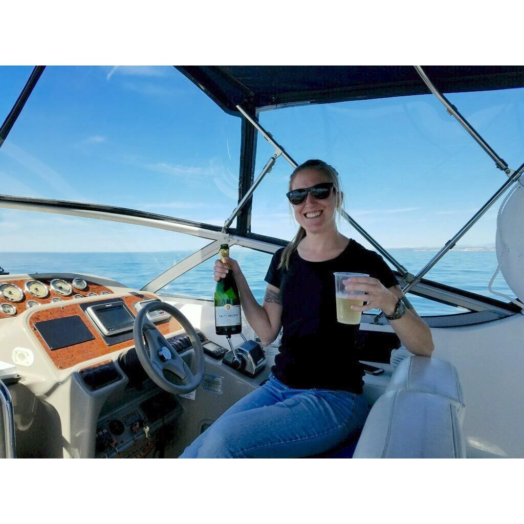 The official renaming of Eileen's boat "Perseverance" out on the ocean.