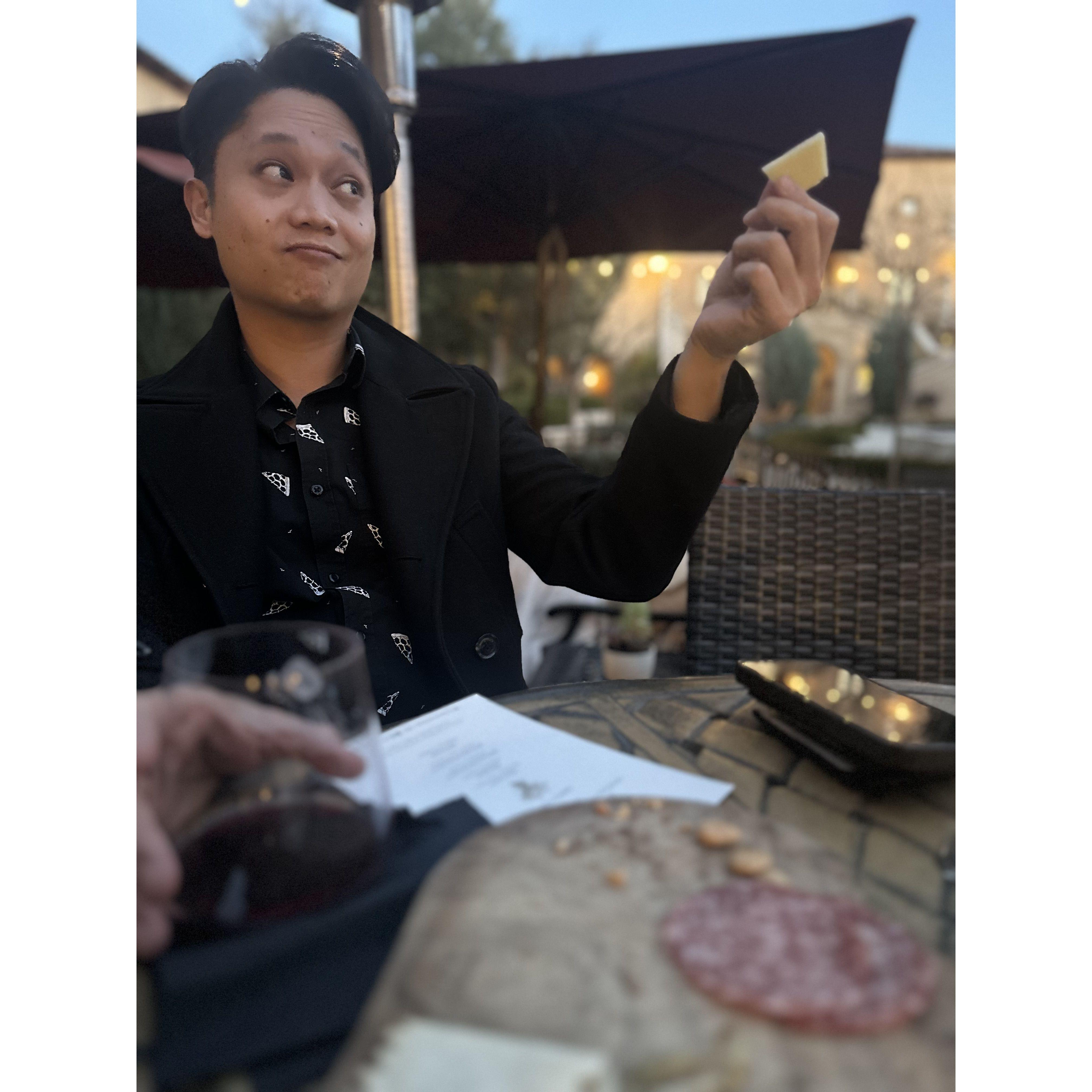 A photo entitled 'Pointing with Cheese'—a gripping tale of Brandon acting weird while Sarah remained oblivious (spoiler: he was minutes from proposing).
