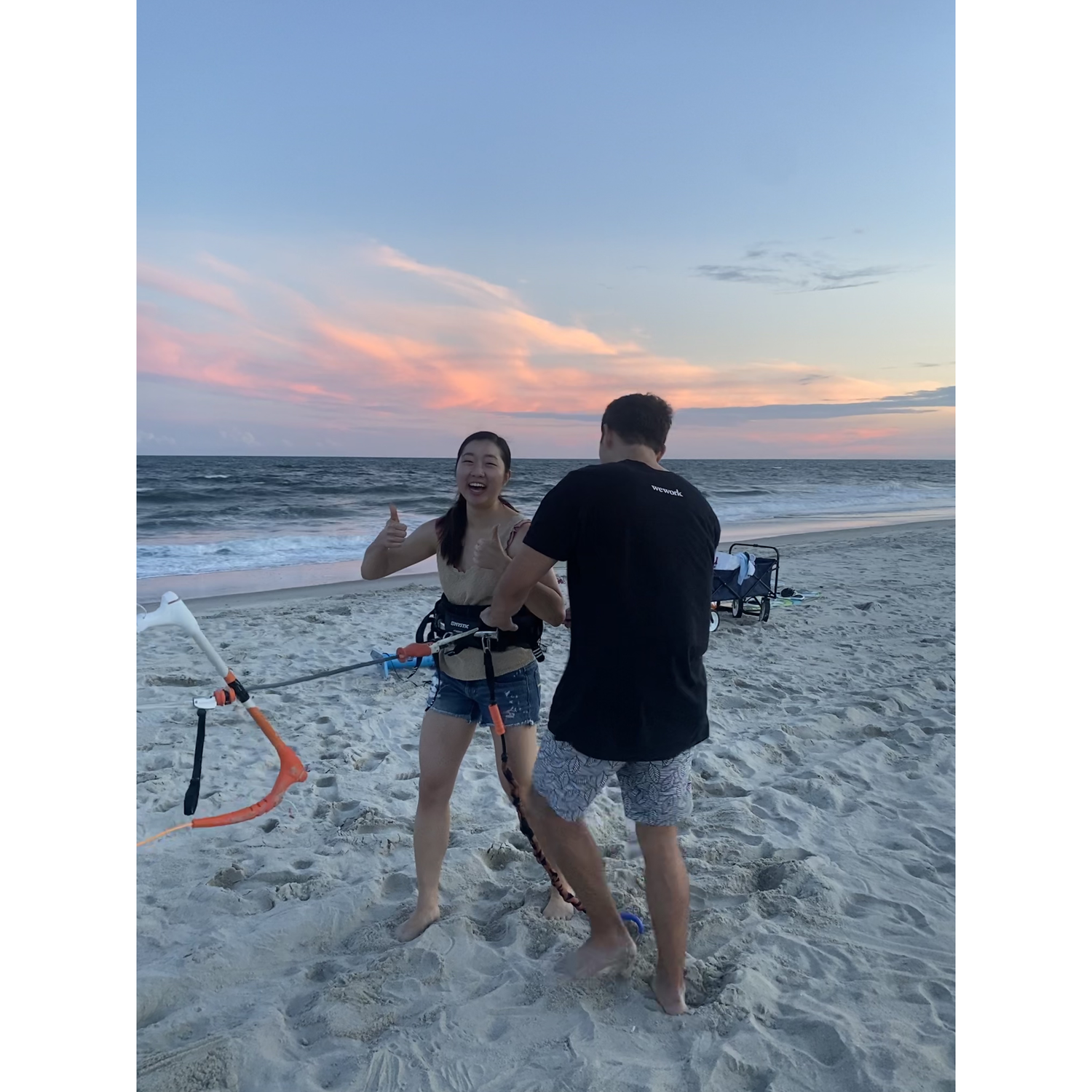 07.16.2022 - James trying to get Annie to test out his kitesurfing harness