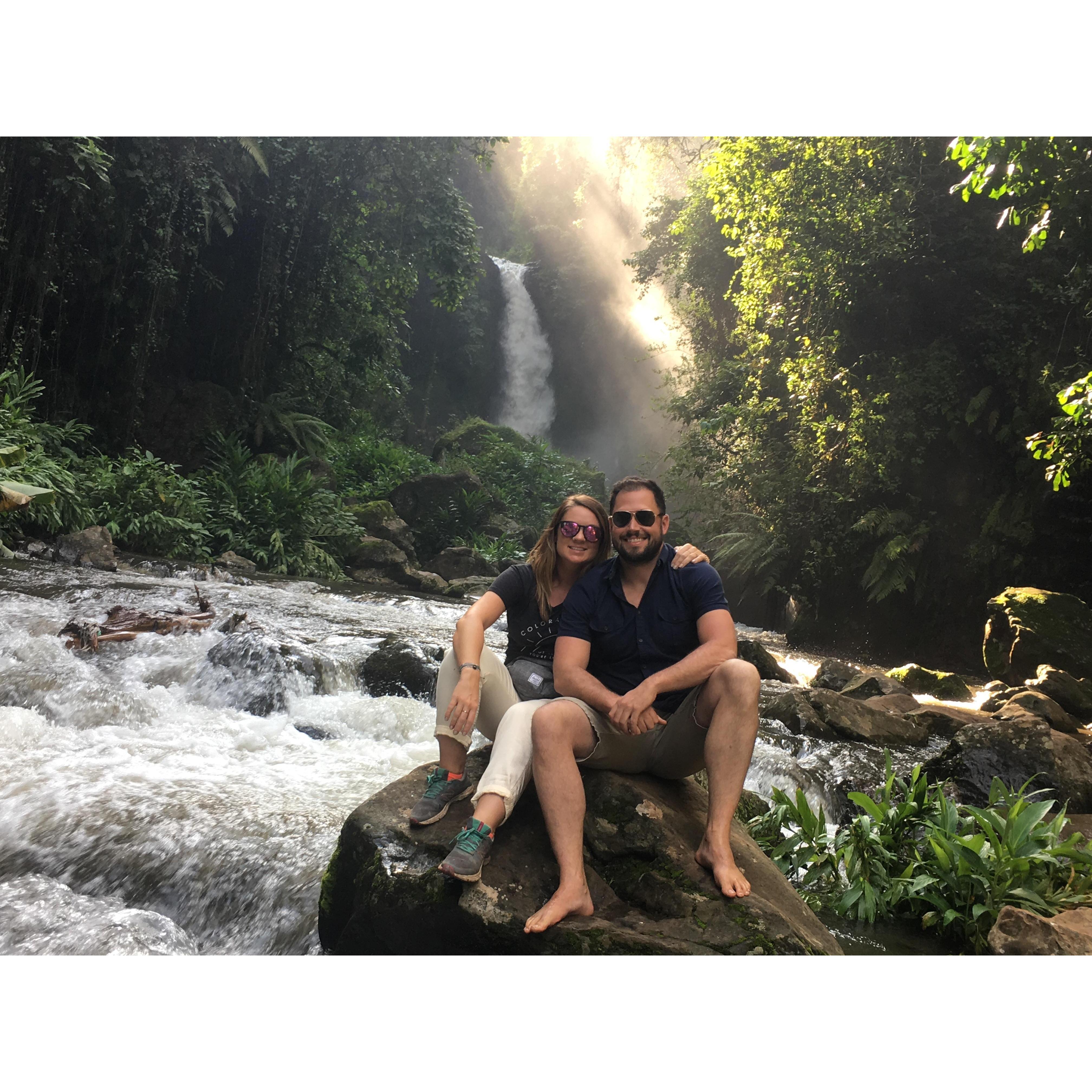 Cooling off in a waterfall while hiking around Mt. Kilimanjaro.
