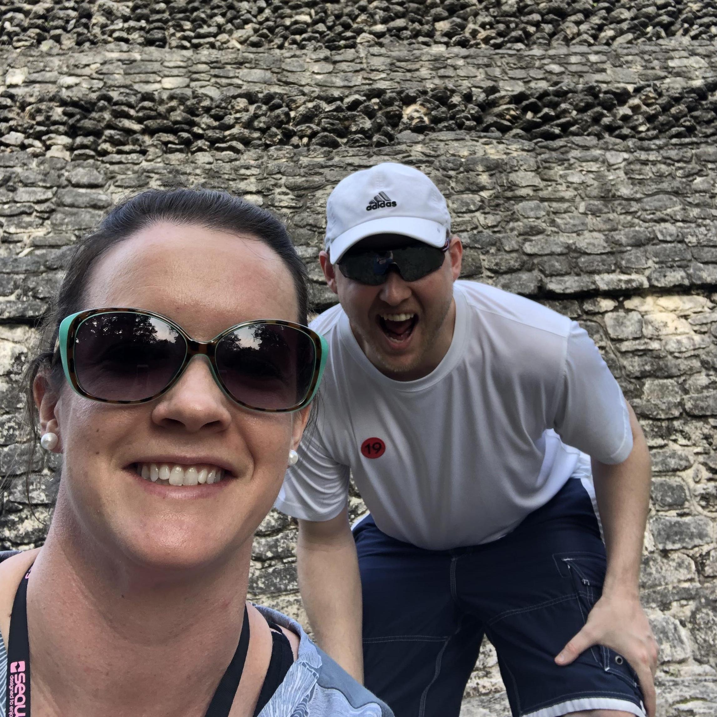in front of a Mayan pyramid