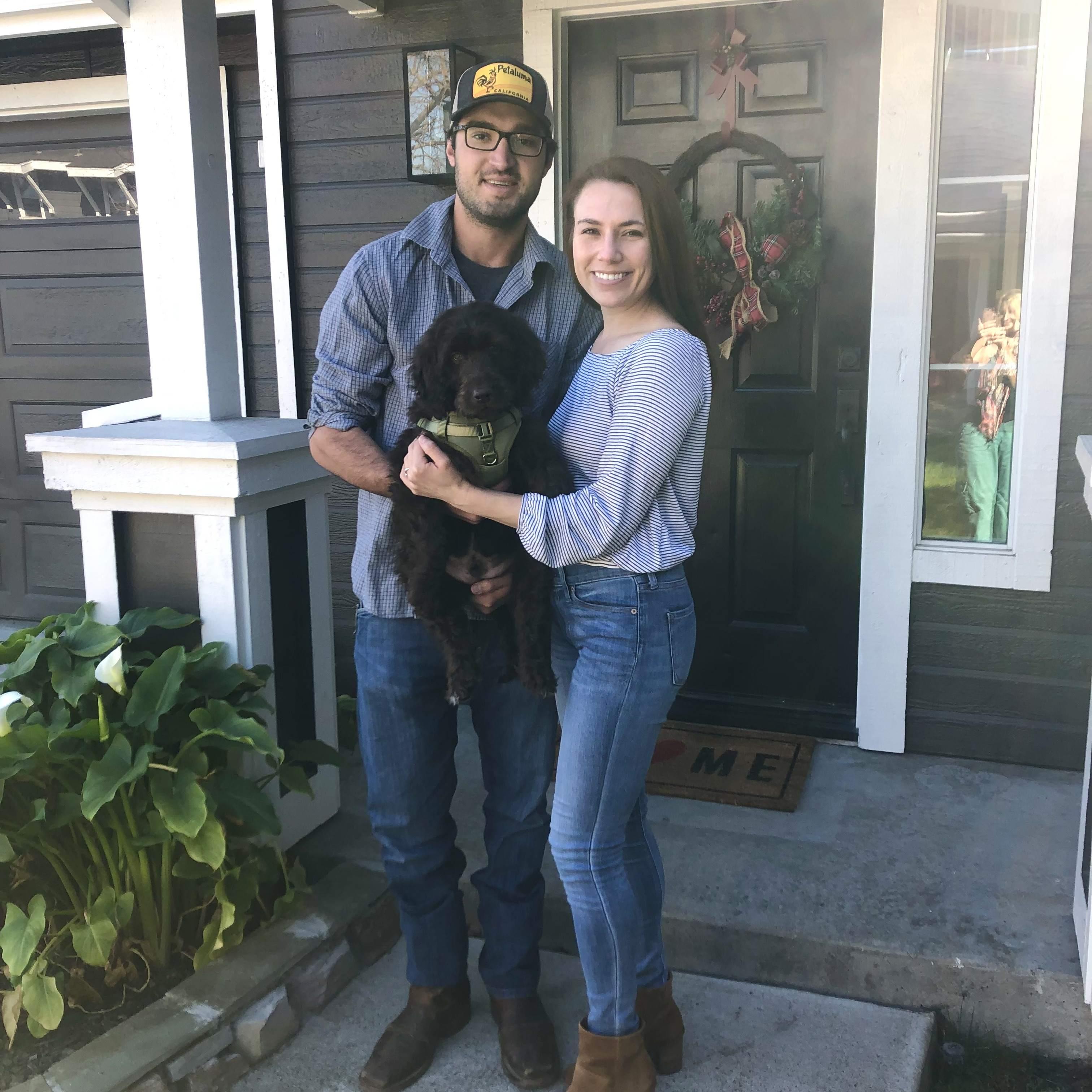 Brittany, Matt, and Murphy in front of their first home in Petaluma. 