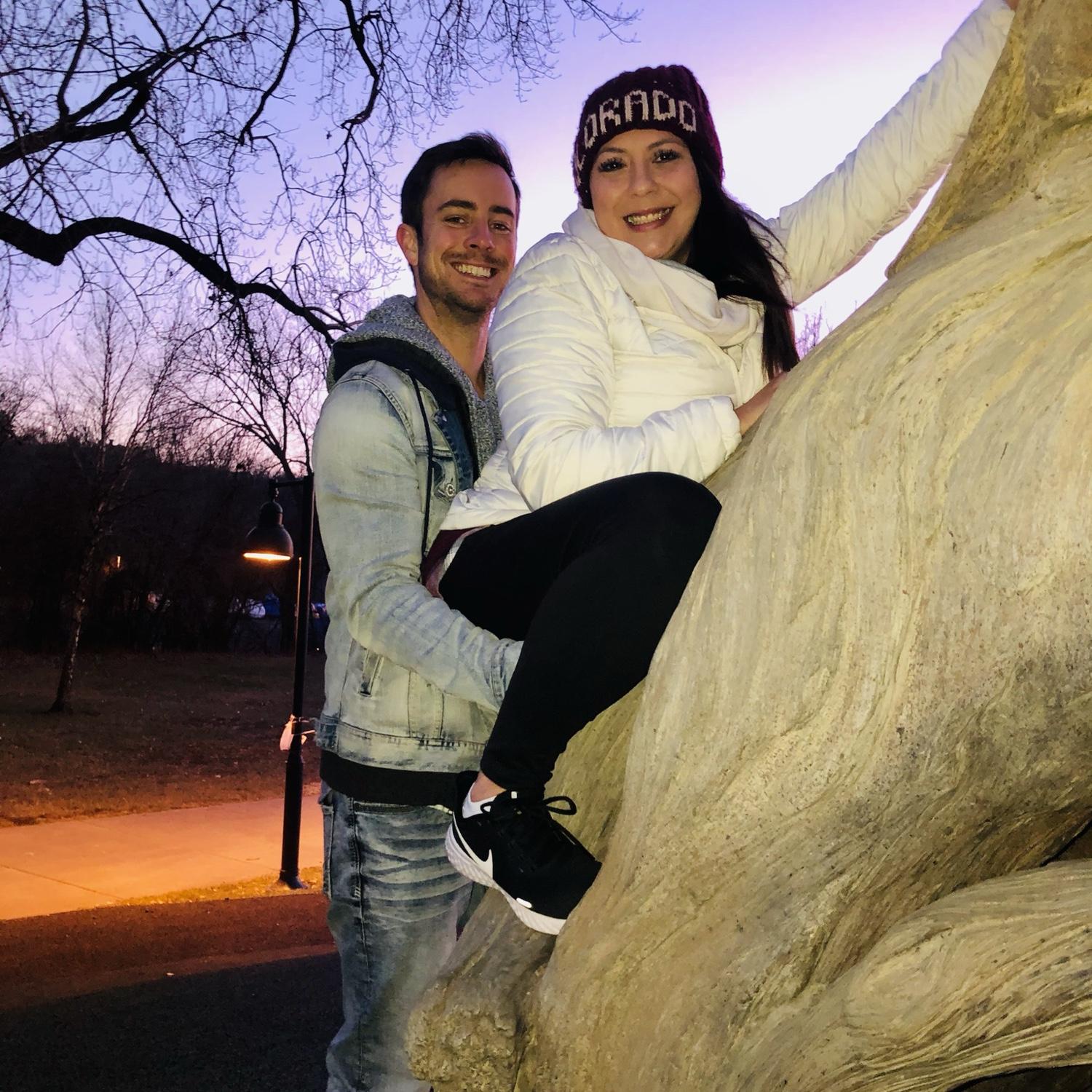 Giving shorty a boost while she climbs trees at the park.