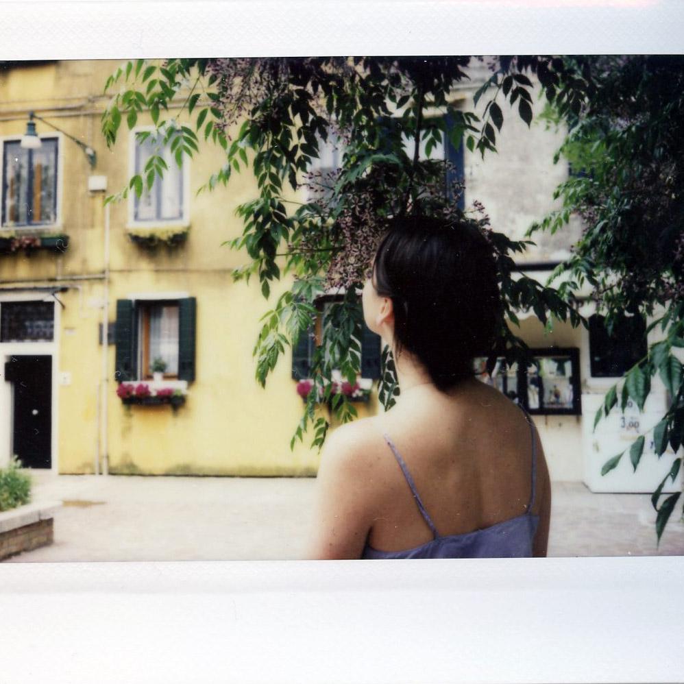 Stopping to smell the flowers in Burano, 2016