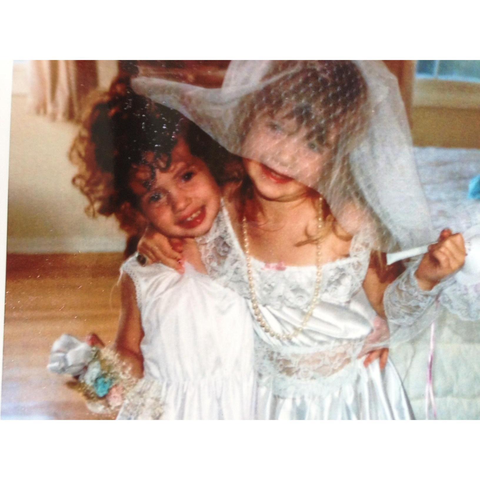 Meg (Taryn's sister/Matron of honor) and Taryn at age 3 and 4, getting ready for the big day! (even though it looks like Megan got to play the Bride that time) :-)