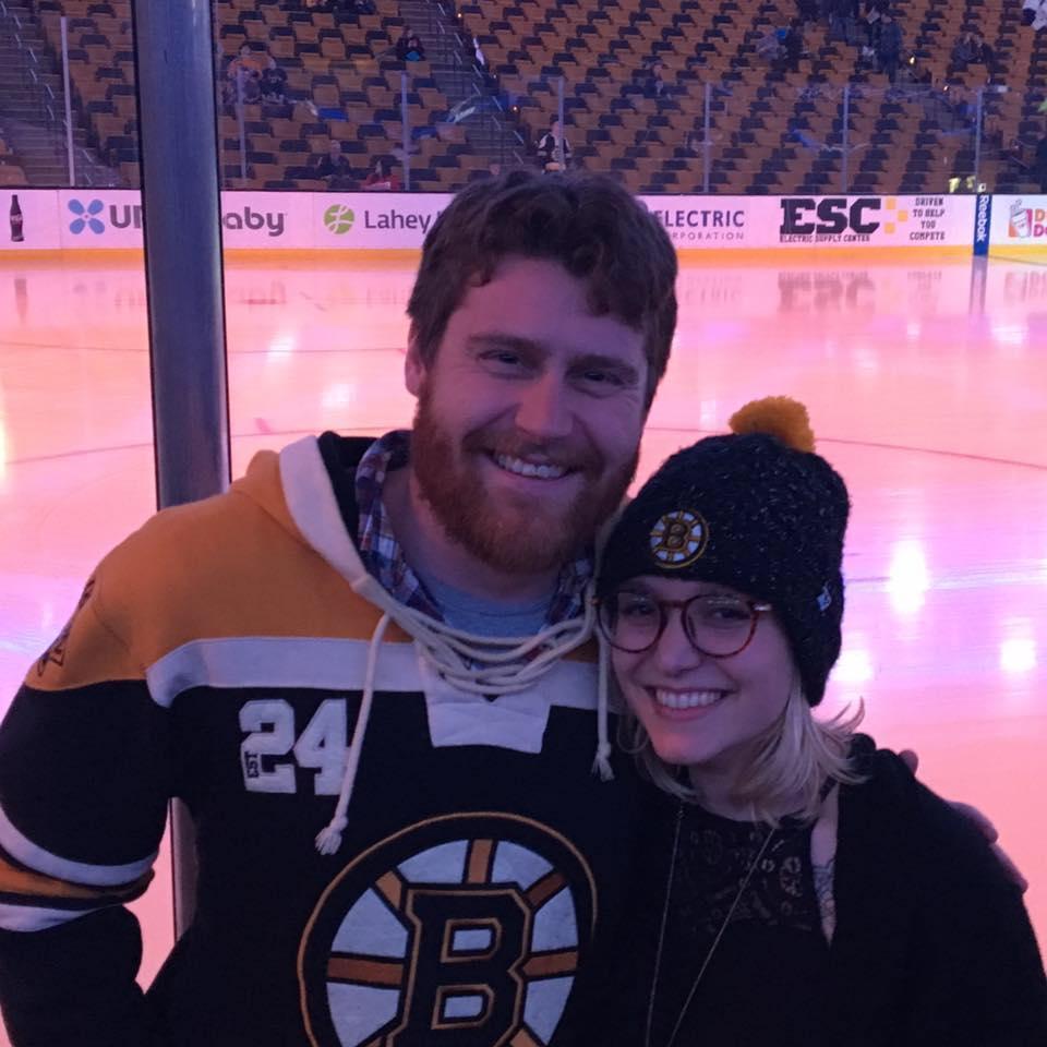 Samantha's bridesmaid, Katie, offered the couple tickets to sit a few rows back from the ice at a Boston Bruins game. The couple tries to make it to at least one game a year as a special date night.