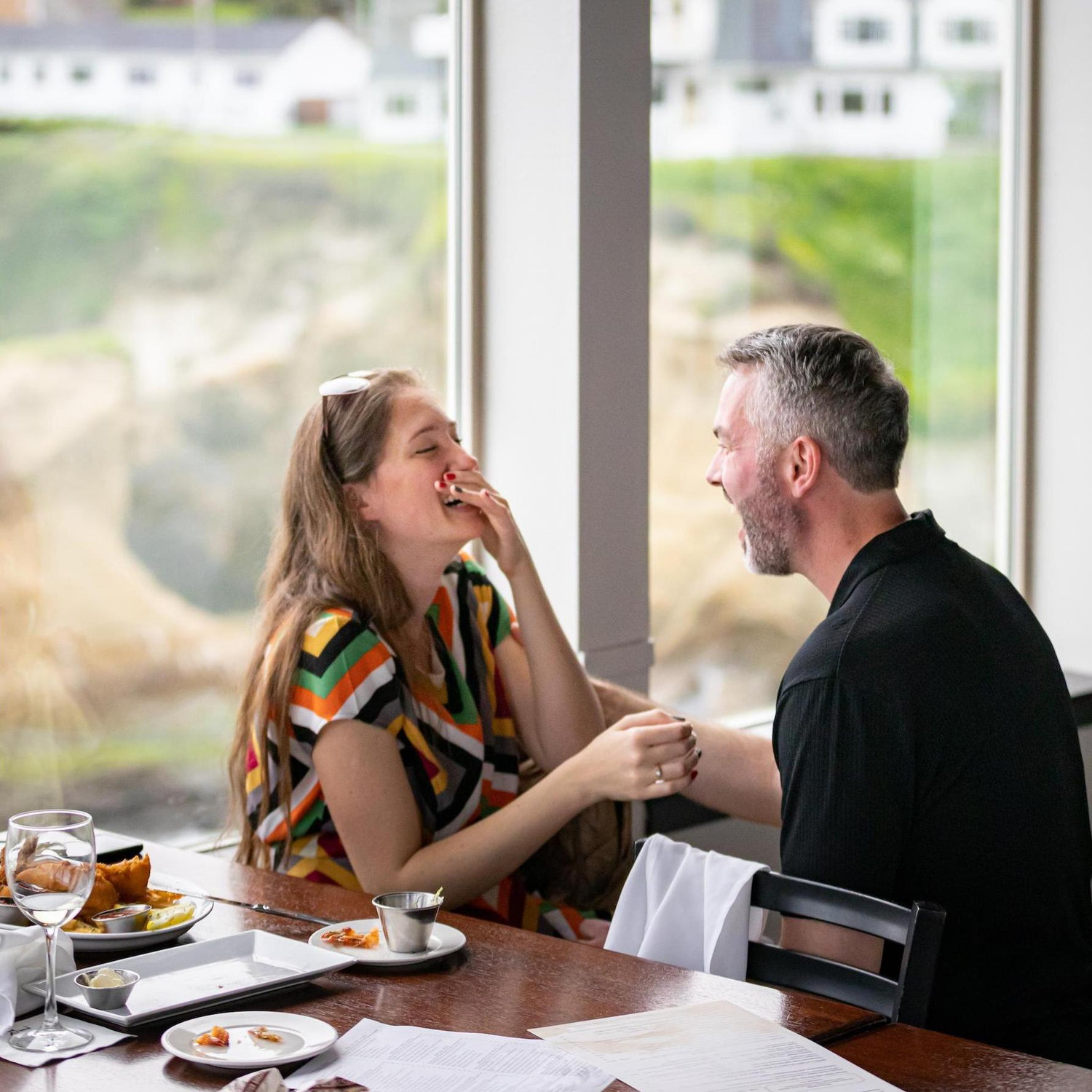 Laughing after the proposal at Tidal Rave's Restaurant