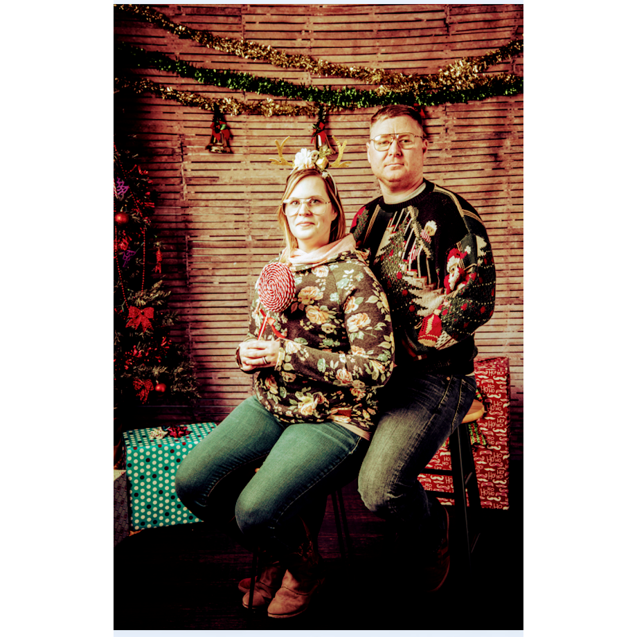 During the Chirstmas Stroll 2018, a photography shop offered "Awkward Christmas Photos"  So, of course we had to do them.  His face in these Awkward Christmas photos kill me haha