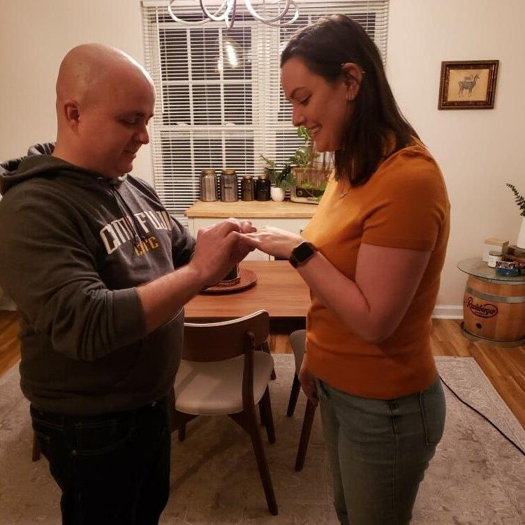12.12.21 - A few months after the proposal, Josh put the engagement ring on Megan's finger. Her ring is entirely made up of gold/diamonds from her family, and was designed by Megan and the jeweler.