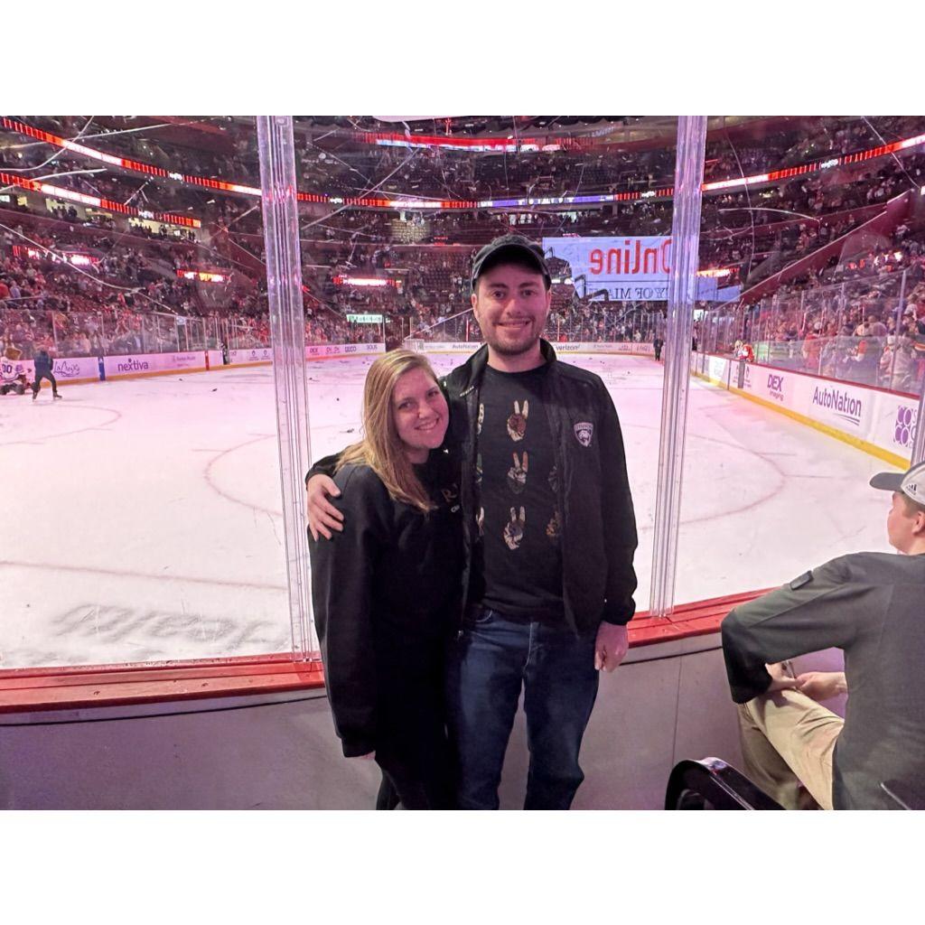 Elana is a huge Patriots fan. She's lucky Drew's knowledge of sports amounts to "score the points" and rooting for the Panthers to win hockey games.