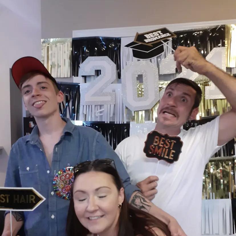 A silly photo of the groom and his siblings at Travis’s graduation party.