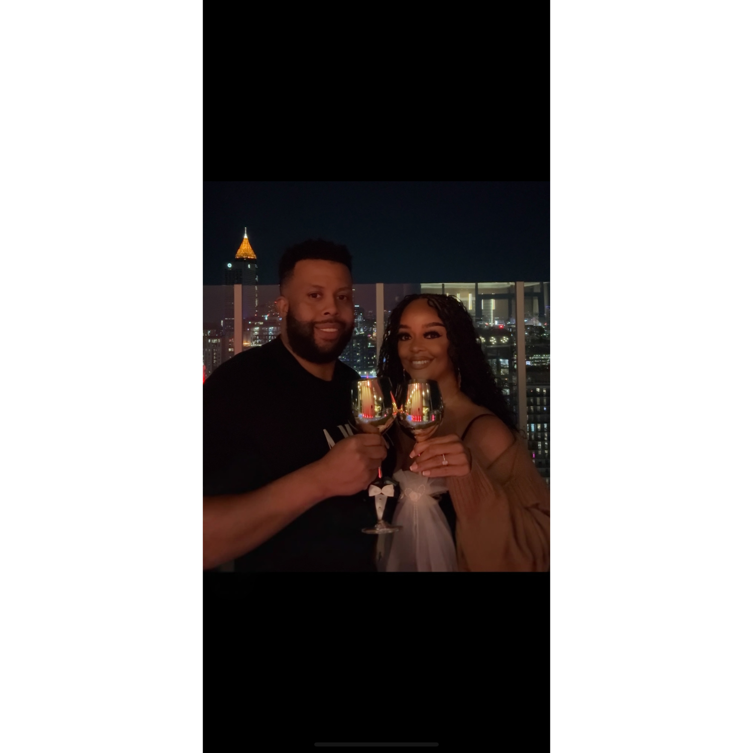 Toasting on the rooftop to our new status of "Engaged"!💍