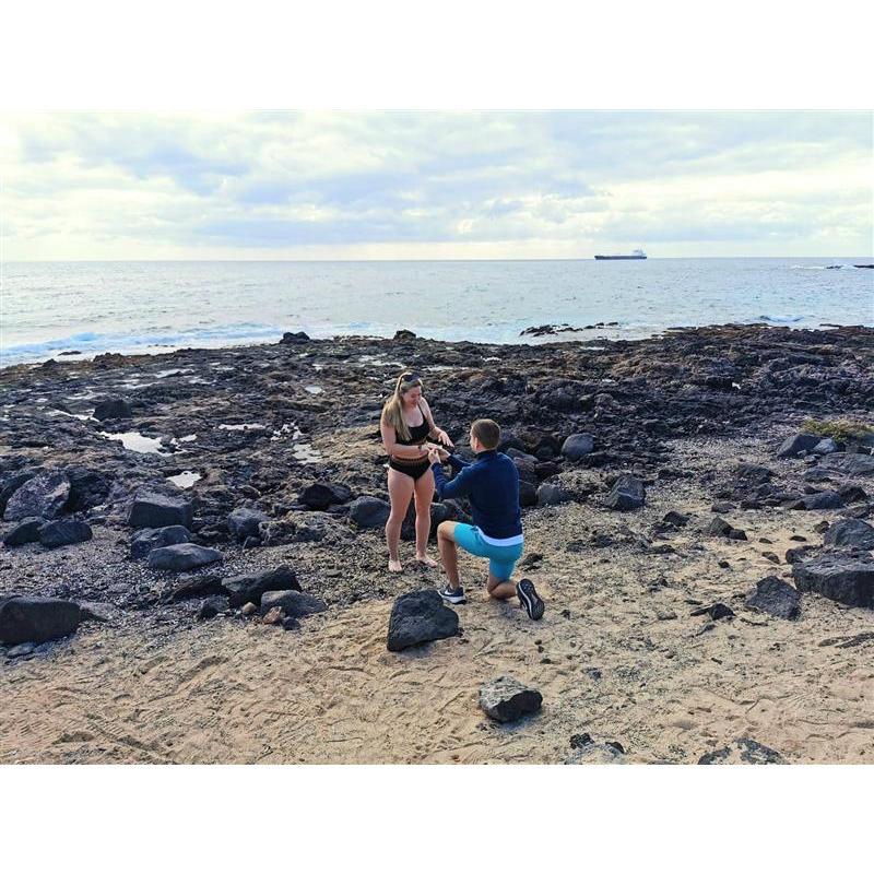 In the beautiful moment, Elle is trying to not sound like a know-it-all, but has to tell Rob he's putting the ring on the wrong hand