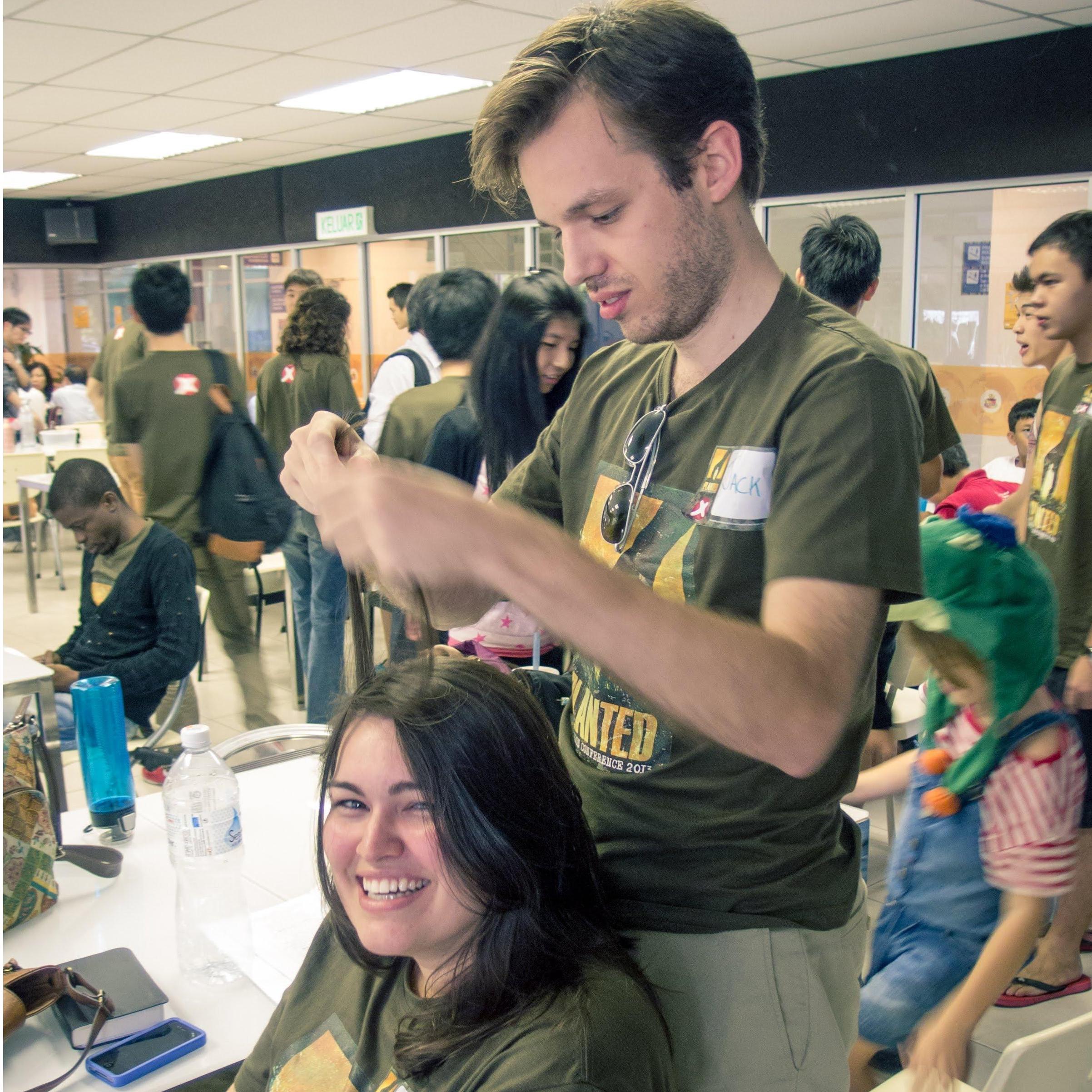 Where it all started - Jack trying to braid Bailey's hair in Malaysia - July 2013